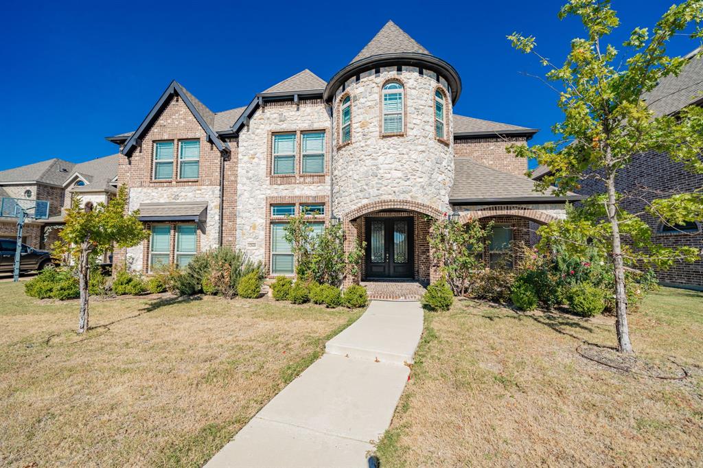 This stunning 2-story home offers 5 bedrooms, 4.5 baths, and a highly functional layout in a sought-after Frisco neighborhood where homes seldom come available. The main level features luxury vinyl plank flooring throughout, an inviting open-concept living area, and a cozy gas fireplace that creates a warm central gathering space. The beautifully designed kitchen includes granite countertops, custom cabinetry, a gorgeous island, gas range, and a spacious breakfast nook with views of the backyard. The first floor also includes a dedicated office, the primary suite with a well-appointed bathroom, and a guest suite. An ornate staircase leads to the second floor, where you’ll find a large game room, a full media room, Jack-and-Jill bedrooms with a shared bath, a charming turret-style nook off one bedroom, and an additional upstairs guest suite with its own full bathroom. The expansive backyard is perfect for entertaining and relaxation with a covered patio, garden space, and a private backyard orchard featuring peach, plum, mulberry, and fig trees. An additional fig tree accents the front flowerbeds. The home also offers an extended living room, expanded breakfast area, solar panels for energy efficiency, and a two-car garage equipped with a NEMA 14-50 outlet for EV charging. Living in Frisco means enjoying award-winning Frisco ISD schools, a strong job market, and exceptional area amenities. Nearby attractions include The Star—home of the Dallas Cowboys' headquarters—Stonebriar Centre, Grandscape, and easy access to the Perot Museum and Dallas Museum of Art. The area offers abundant parks, professional sports, cultural activities, and an outstanding quality of life with favorable living costs relative to income. Convenient access to Hwy 121, the Dallas North Tollway, and US-75 places major shopping, dining, entertainment, and employment hubs just minutes away. This home is a rare opportunity in a neighborhood where homes don’t come up often and is truly a must-see.
