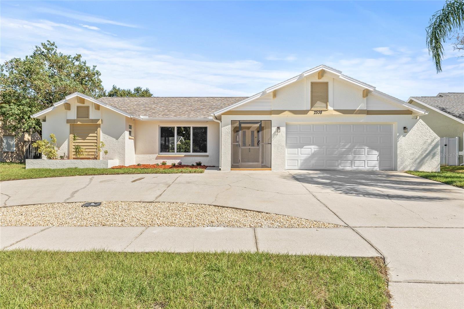 Welcome to your dream POOL home in beautiful Dunedin! This spacious 3-bedroom, 2-bathroom residence offers the perfect blend of comfort, style, and functionality all tucked away in a non-flood zone for peace of mind. Step inside to a light-filled living room with soaring vaulted ceilings, creating an open and airy atmosphere perfect for relaxing or entertaining. The updated kitchen is a chef’s delight, featuring brand-new cabinets, sleek stone countertops, stainless steel appliances, and a cozy eat-in area. Just off the kitchen, the dining area provides a perfect space for enjoying meals with family and friends. The primary suite is a serene retreat with vaulted ceilings, ample natural light, a spacious walk-in closet, and a private ensuite bathroom complete with a dual vanity and sleek, modern finishes. On the opposite side of the home, you’ll find two well-appointed guest bedrooms and a second bathroom with a trendy renovation. You'll also find a dedicated laundry room with a utility sink adds convenience and functionality. Step out back to your private oasis: a covered patio overlooks a screened-in sparkling pool, perfect for year-round enjoyment. Beyond the screened enclosure, a grassy yard provides plenty of space for kids to play or pets to roam. Recent upgrades elevate this home even further, enjoy NEW impact windows, NEW sliding glass doors, and a NEW garage door for enhanced safety, energy efficiency, and peace of mind. Additional highlights include a 2-car garage, a brand-NEW roof, and a NEW HVAC system, offering years of worry-free living. All of this in a fantastic location just 25 minutes from Clearwater Beach, 10 minutes from downtown Dunedin, and close to many great restaurants. Don’t miss your chance to own this move-in-ready home in one of Dunedin’s most desirable neighborhoods. Schedule your private showing today!
