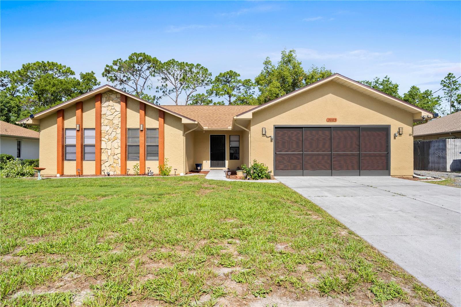 Welcome to this beautifully updated 3-bedroom, 2-bathroom pool home nestled on a fully vinyl-fenced .23-acre lot in the heart of Spring Hill, FL. Designed with comfort, functionality, and style in mind, this home features a desirable split floor plan offering privacy for the whole family.

The spacious master suite is located on its own side of the home and includes a walk-in shower, while two guest bedrooms and a full bath are situated on the opposite wing. The inviting living area features durable laminate flooring and a cozy fireplace, creating a warm, welcoming space to relax. The kitchen is equipped with stainless steel appliances, tile flooring, a bright eat-in nook, and a formal dining room—perfect for hosting guests. Bedrooms are comfortably carpeted, and both bathrooms are finished with tile. Additional interior highlights include an indoor laundry room, water softener, and a new irrigation system for easy yard maintenance.

Step outside to your private backyard retreat featuring a saltwater Pebble Tec pool with a lifetime warranty, all enclosed in a screened-in, pavered lanai—ideal for relaxing or entertaining year-round. The home also includes a 2-car garage and a newer septic system (2017) for peace of mind.

Centrally located near shopping, schools, hospitals, and just a short drive to the beautiful Weeki Wachee River, this home checks all the boxes for comfortable Florida living!