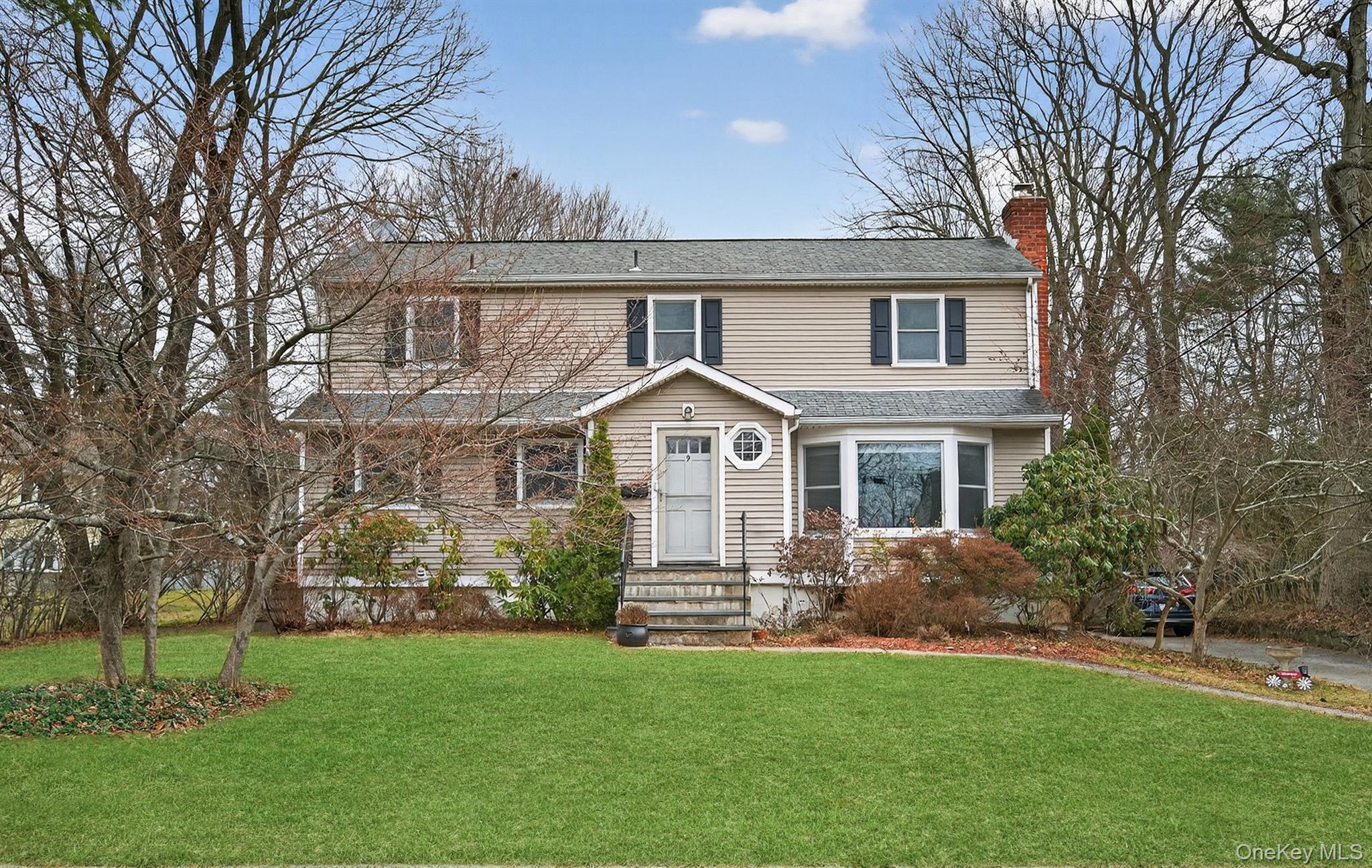 Welcome to 9 Verne Place, a lovely 4-bedroom, 2-bath, front-to-back, split-level home, set on a quiet street in the sought-after Poets’ Corner neighborhood of Hartsdale, known for its peaceful streets, established homes, and convenient access to transportation and everyday amenities.Offering attractive curb appeal with a welcoming exterior, step in to the main level featuring a comfortable and well-laid-out combination of a kitchen, dining room, and spacious living room. The living room features a wood pellet stove adding everyday warmth and efficiency during the chilly winter months.The second level includes two bedrooms and a full bath, while the third level offers two additional bedrooms and a second full bath, creating a thoughtful layout that allows for privacy, flexibility, and a variety of living arrangements.The finished lower level enhances the home's livability, offering a family room or office space with convenient walkout access to the backyard, making it ideal for remote work, relaxation, or play.Step outside to enjoy the expansive, level backyard, beautifully landscaped and ready for your personal touch; imagine hosting barbecues or creating a serene garden retreat.Additional features include an attached one-car garage and ample storage, all within close proximity to shopping, dining, parks, and transportation. A commuter’s dream; just minutes to Hartsdale Metro-North with express trains reaching Grand Central in approximately 35 minutes.Make this delightful home your own today!