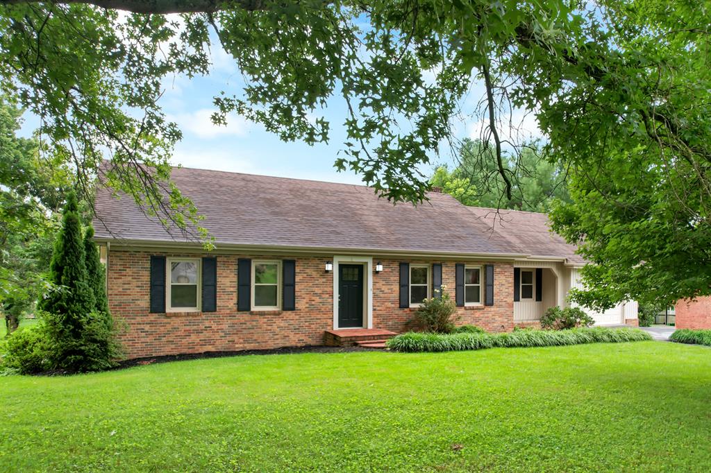 Enjoy comfortable one-level living in this mostly brick, three-bedroom, two-bath ranch situated on over half an acre in the county, offering the benefit of county taxes while remaining just minutes from town, shopping, dining, and Interstate 81.  Step inside to a spacious, light-filled living and family room featuring beautiful hardwood floors, a stunning brick fireplace, and direct access to the screened porch—the perfect place to enjoy your morning coffee or relax in the evening.  The functional floor plan includes a private primary suite with an ensuite bathroom featuring a walk-in shower, while two additional generously sized bedrooms are located near the full hallway bathroom with tile flooring and a tub/shower combination. A one-car attached garage provides added convenience and storage.  The full unfinished basement offers abundant storage and endless possibilities for future expansion, whether you envision additional living space, a recreation room, workshop, or home gym.  Conveniently located near two major golf courses, this home also offers quick access to the Hard Rock Hotel & Casino Bristol and the historic downtown areas of Abingdon and Bristol.  With its beautiful setting, solid construction, desirable location, and endless potential, this property offers the perfect combination of comfort, convenience, value, and room to grow. Don't miss this opportunity to make it your own! List agent is owner.