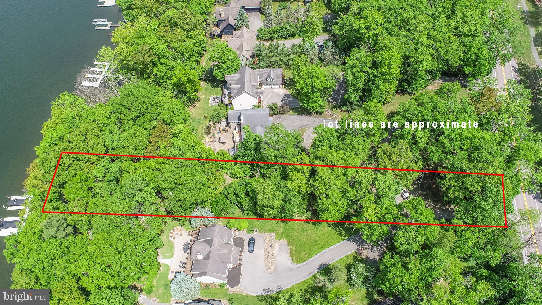 RARE OPPURTUNITY! Discover one of the final opportunities to own true lakefront on the iconic Glendale Road! This premier homesite offers approximately 75 feet of pristine Deep Creek Lake frontage in a serene no wake zone, perfect for swimming, kayaking, and peaceful lakeside enjoyment. Zoning in this area is Town Center. This allows for a larger building area within the lot with relaxed setbacks.The property includes one dedicated slip on a small 3-slip community dock, providing easy lake access without the upkeep of private dock ownership. Located in the heart of one of Deep Creek’s most desirable rental and recreational areas, this location is proven to perform — surrounding properties consistently gross between $150K–$200K annually as short-term rentals, making this an ideal build site for both personal use and investment.Just minutes from DCL’s favorite hotspots — Honi-Honi, Arrowhead Market, Firewater Kitchen & Bar, Dutch’s at Silver Tree, Deep Creek Lake State Park and Wisp Resort — plus marinas, shopping, and more.Whether you envision a modern vacation home, a luxury rental retreat, or a legacy lakefront getaway, this rare Glendale Road lot delivers exceptional location, strong rental potential, and the lake lifestyle everyone wants. Opportunities like this are nearly gone — don’t miss your chance!