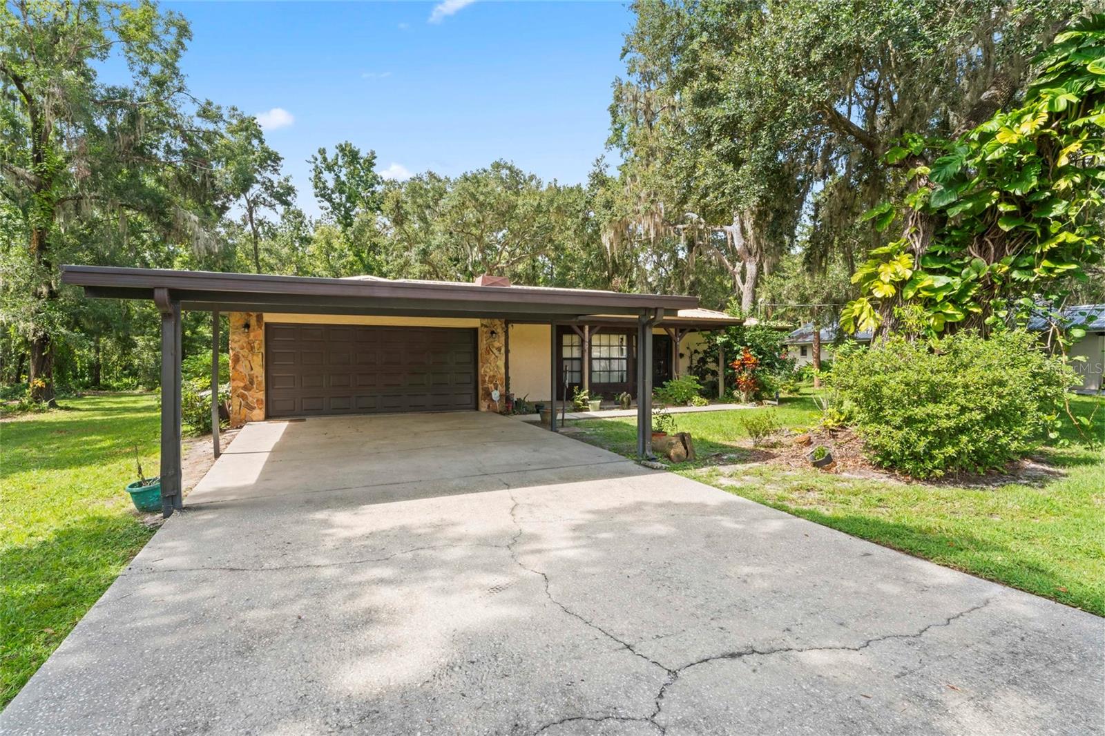 Welcome to this lovingly maintained 3-bedroom, 2-bathroom block home, custom-built by the original owner and full of timeless character. Nestled on a generous .321-acre lot in a peaceful and established neighborhood, this home offers a rare blend of privacy, charm, and convenience.

Step inside to discover a warm and inviting living space featuring a cozy fireplace, perfect for relaxing evenings at home. The thoughtful layout offers a balance of open living areas and private bedrooms, ideal for both entertaining and everyday living.

Outside, enjoy the serenity of quiet surroundings and the beauty of mature trees and a spacious yard with plenty of room to garden, play, or simply unwind. Located in the heart of Plant City, you're just minutes from local shops, restaurants, parks, and schools—yet tucked away in a tranquil setting.

Whether you're looking for a family home or a charming piece of Florida history, this property is a must-see.