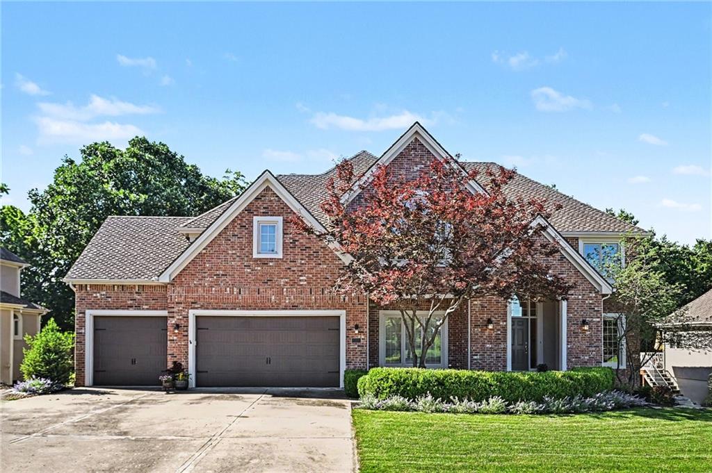 Welcome home to 8033 Clearwater Drive. This premier property offers luxury and comfort in historic Parkville. With 5,300 sq ft of finished living space, the stately residence sits on a premium lot of just under 20,000 sq ft. The large backyard features mature trees, creating a park-like setting that extends to a small neighborhood creek. This private backyard oasis can be enjoyed from two spacious outdoor living areas.An elegant split staircase greets you in the main foyer, leading to a substantial, classic layout. The main level features a formal dining room, family room, hearth room, and a dedicated home office. The gourmet kitchen includes rich cherry cabinetry, a premium vented Dacor 6-burner gas cooktop, and abundant storage. The main level is flooded with natural light from south-facing windows and features its own walk-out deck.The second level houses four spacious bedrooms, highlighted by a true primary retreat. This expansive 28’8” x 17’11” suite overlooks the backyard forest for exceptional privacy. It includes a fireplace-warmed sitting area with built-in bookshelves, a massive en suite bathroom, and a huge walk-in closet. The main guest suite features a vaulted ceiling and private bath, while bedrooms three and fourth share a Jack-and-Jill layout. Downstairs, the versatile walk-out basement serves as the ultimate hangout, featuring a wet bar, workshop, ample storage, and a secluded fifth bedroom suite with a full bath. The open rec area connects easily to a beautiful lower deck.Experience the ultimate resort lifestyle in Riss Lake. This premier 134-acre waterfront community features three pools and a swim team, with the main pool just a short walk away. Amenities include a playground, nature trails, and courts for tennis, pickleball, basketball, and sand volleyball. Enjoy weekends on the stocked lake, complete with a private marina. This prime location is minutes from downtown Parkville and a short drive to KCI Airport and downtown KC.