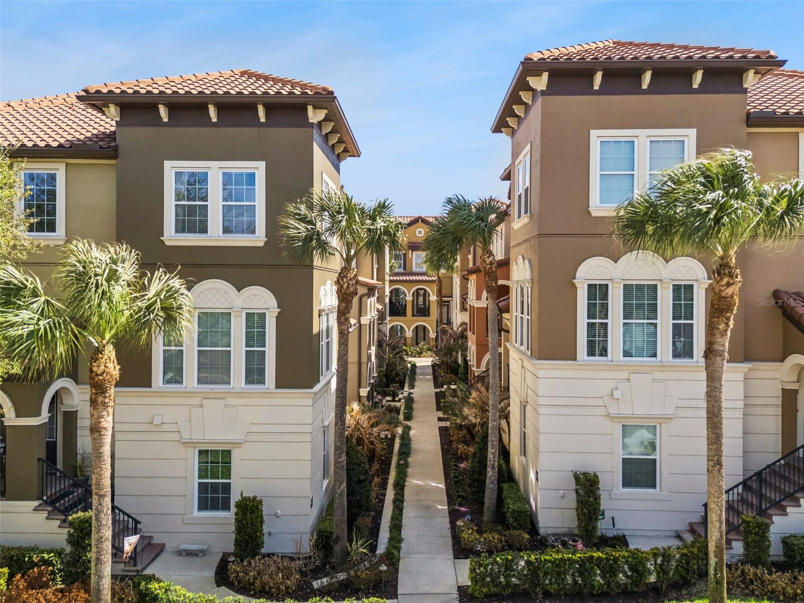 NEW PRICE $425,000 PLUS SELLER IS OFFERING $5000 TOWARDS BUYERS CLOSING COSTS, BUY DOWN OF MORTGAGE INTEREST RATE!MUST SEE this picturesque Guard Gated Fountain Parke 653 Pavia Loop trilevel townhome built by Aston Woods!  Enter your front door on the main second level there is a spacious Living Room, Half Bath Powder Room, Full Gourmet Kitchen, Family Room/Dining room and sitting area or nook. The entire second level features ceramic tile and flows openly great for entertaining. Off the Family Room/Dining Room, Kitchen area is a sun drenched patio for outside dining or relaxation. The Gourmet Kitchen features Calcutta Marble and Full Backsplash, large Island for entertaining, closet pantry, Kitchen Nook area, and all appliances included. You'll enjoy two spacious Primary Suites on the third floor with ensuite bathrooms and large walk in closets. The third floor also has a laundry room including the washer and dryer. On the lower level there is a third bedroom with walk in closet and full bathroom. Would make a great office for those working from home. Under the stairs there is a huge "Harry Potter" closet space for extra storage. All stairs, first an top floor hallways and bedrooms are renovated with BRAND NEW LUXURY VINYL PLANK FLOORS NO CARPET ANYWHERE! Walk right out to your attached FULL TWO CAR GARAGE. SELLER IS OFFERING ONE YEAR HOME WARRANTY FOR NEW BUYER! Fountain Parke is full of Resort like amenities including, large clubhouse, tropical stunning community pool, onsite property management, tennis courts/pickleball courts, playground and dog park. Conveniently located in the highly desirable town of Lake Mary! This is a beautifully designed Mediterranean inspired community, centrally located and ideal for your next home!