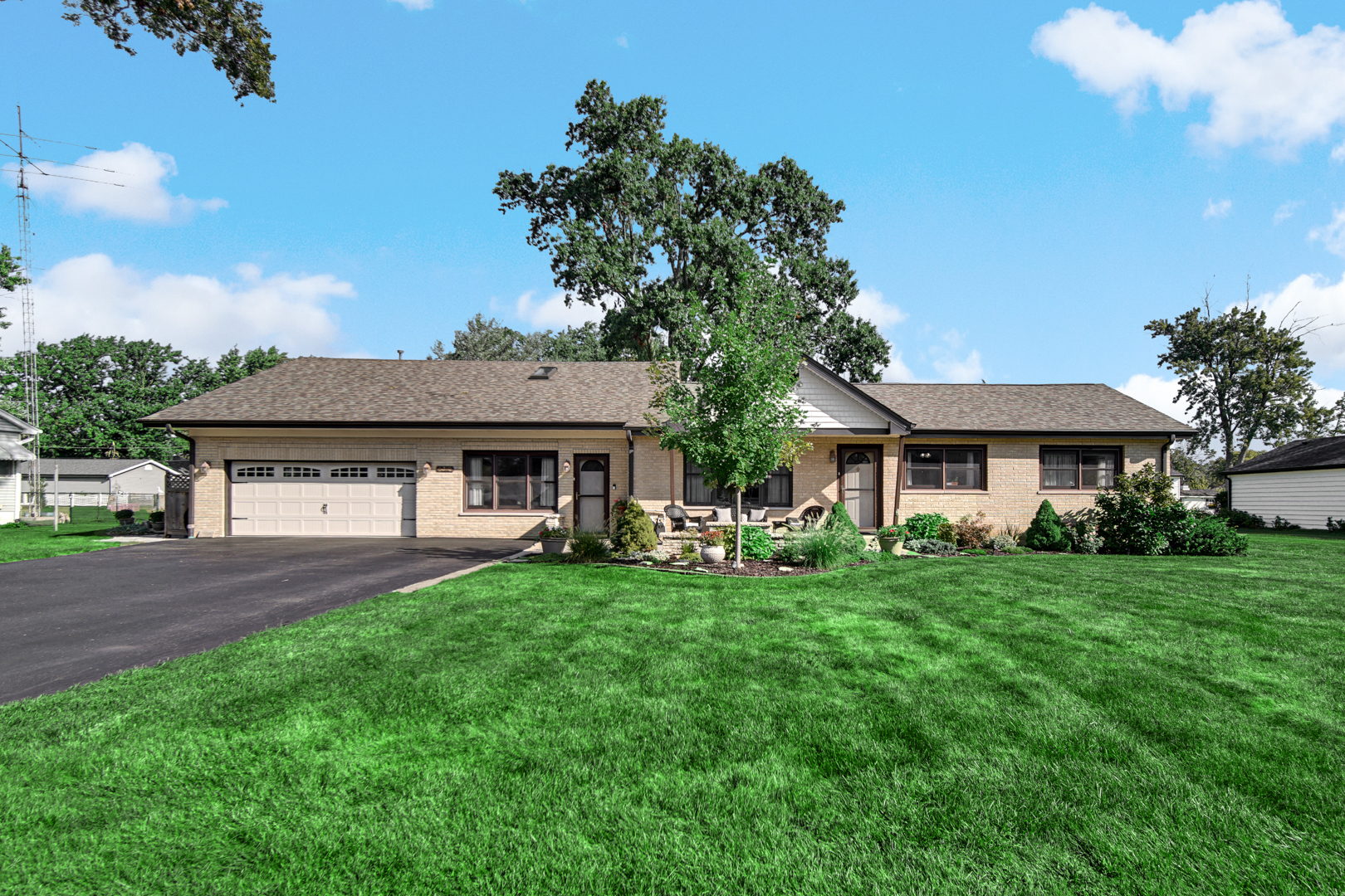 Welcome to 8210 W. Hillcrest Drive, an extraordinarily versatile 5-bedroom, 3-full-bathroom sprawling brick ranch offering 2,810 square feet of meticulously maintained living space. Situated on a beautifully landscaped lot in unincorporated Palos Township with an Orland Park mailing address, buyers will appreciate the benefit of lower township property taxes while enjoying access to Palos Community Consolidated School District 118 and District 230 boundaries.  Inside, gleaming hardwood floors flow through an expansive floor plan designed for effortless daily living and flexible hosting. The updated kitchen features rich quality cabinetry, ample pantry storage, quartz countertops (2019), premium stainless steel appliances including a double oven (2019), and a dual-connected Reverse Osmosis filtration system routed to both the kitchen sink and refrigerator line. Relax in the primary bedroom suite, complete with an Elfa adjustable closet organization system and a spa-like bath featuring a 6-foot jetted tub and a heated exhaust fan. A dedicated main-floor suite-boasting its own full bath and a private exterior entrance-offers an ideal setup for long-term guests or a quiet home office.  The upper-level expansion above the garage introduces two spacious bedrooms, a full bathroom, and a flexible central sitting/media lounge with cozy architectural ceilings and abundant knee-wall storage.  Extensive high-value updates and outdoor amenities provide true peace of mind and effortless entertaining:  Roof: Class 3 impact-resistant roof (2025)  HVAC: Dual furnaces (2018 & 2006) and central AC (2018)  Exterior: Vinyl siding & gutters (2017), asphalt driveway (2019), brick paver patio with underground drainage (2019), and an inviting custom firepit perfect for outdoor gatherings  Garage & Outbuilding: New insulated garage door with fresh concrete garage floor (2019/2020), plus a charming, oversized outdoor shed outfitted with both running water and electricity.