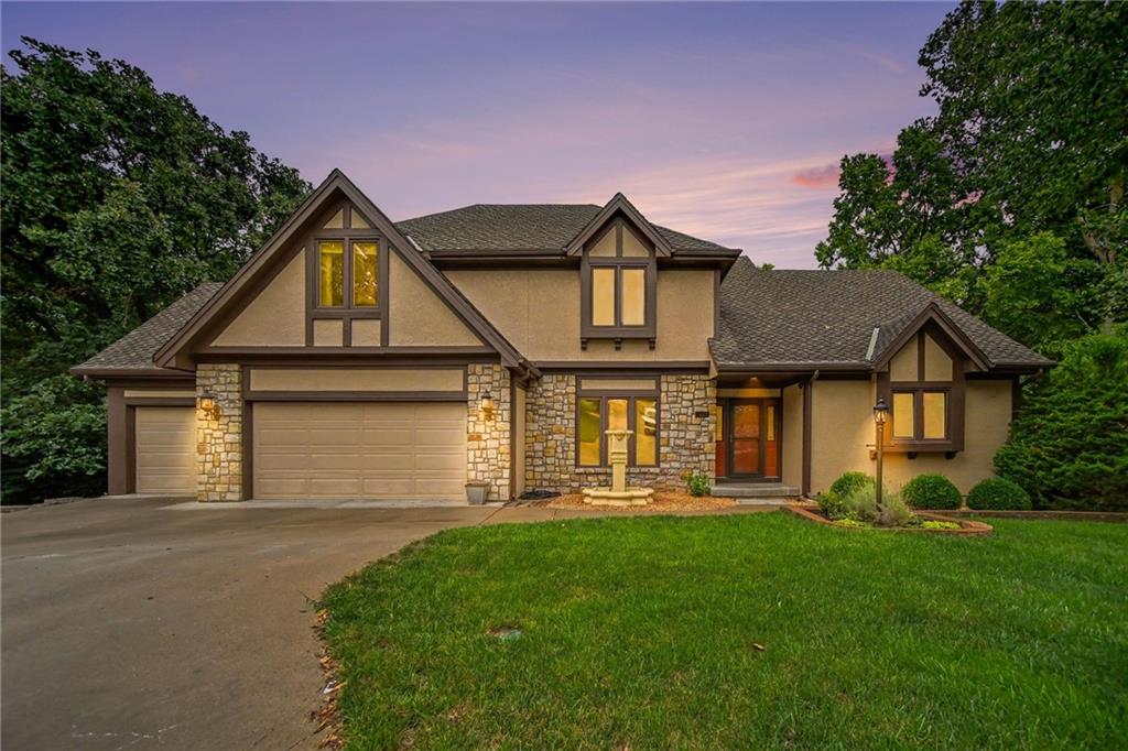 THE BEST VALUE IN RISS LAKE WITH THE NEW PRICE OF $599,99!   Amazing 1.5 Story home on a secluded cul-de-sac backing to trees and the Riss Lake nature trail. Enjoy all of the seclusion and beauty of living in the woods plus all of the conveniences of living in the Premier Northland Lake Community!  One block from the Woodhaven Pool, Tennis Courts and Play area and a short stroll to the marina at Riss Lake! You're going to LOVE LIVING HERE!  This well constructed home has been lovingly maintained and updated by only two families. Spacious main level with an incredible owner's suite, formal living room, dining room kitchen and more!  NEW hardwoods were added to the mail level recently. Three more large bedrooms upstairs (one with an ensuite bath) and all feature walk-in closets. There is an additional bedroom and full bath on the lower level.  Cozy up to the two fireplaces this winter one on the main level and one in the lower level. Most all of the lighting fixtures are new along with much of the carpet. Huge recreation room downstairs along with lots of unfinished storage space and a SUSPENDED GARAGE.  You'll enjoy the outdoors and marvel at the wildlife from the upper level deck and lower level patio. Epoxy coated floor in the HUGE 3-Car garage! The exterior of the home is in excellent condition INCLUDING A BRAND NEW 50-YEAR COMPOSITION ROOF!  So many features to love about this home and community! Parkville is the place to be and 5525 Oakdale Place is the perfect place to call home!  COME AND SEE THIS HOME TODAY!