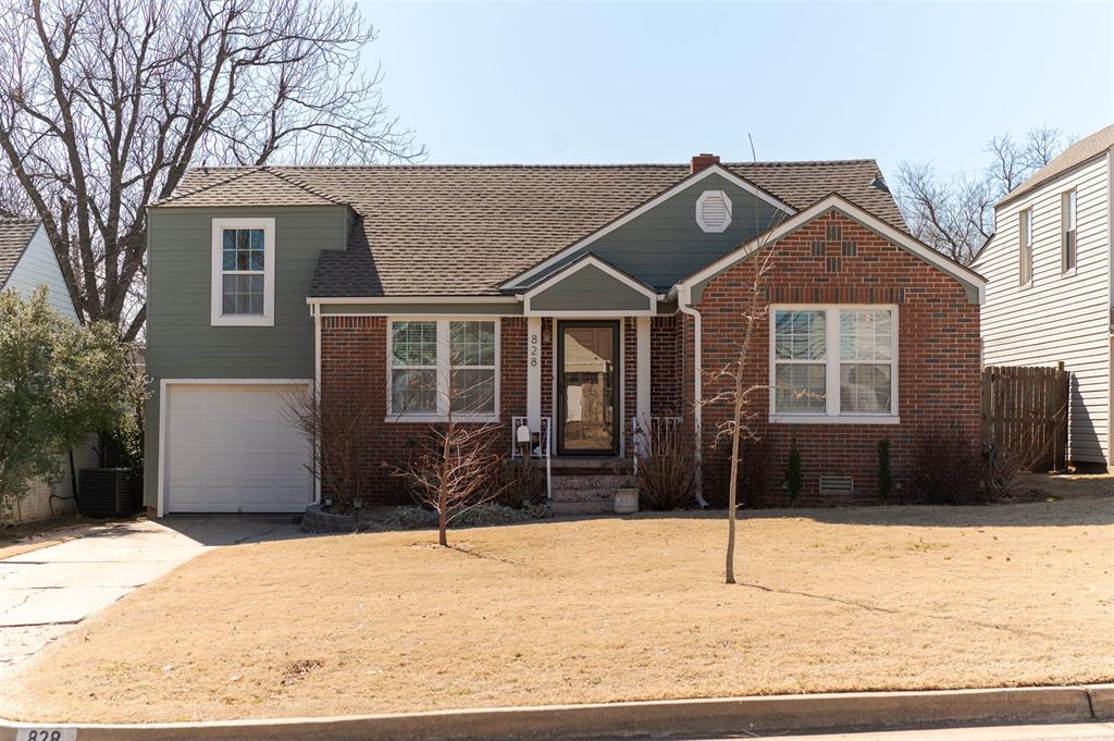 This 1941 split-level home in Douglas Edgemere beautifully combines original character with thoughtful modern updates. From the moment you arrive, its curb appeal shines through decorative diamond brickwork and multi-toned brick in deep red, burnt sienna, and terracotta set against green siding. The result is a timeless look that feels both classic and current. Step inside and you are welcomed into a living room that carries nearly eighty years of history with grace. Blue-grey walls pair with white wainscoting and refinished original hardwood floors to create an inviting space. Modern upgrades complement the home's vintage charm, blending the best of both worlds. The kitchen was fully reimagined with a nod to Miami Art Deco style. Cool mint shaker cabinets, gold hardware, granite countertops, and a peninsula island come together beautifully. A hand-painted black and white floral mural adds bold character and artistic flair. A cozy dining nook with built-in bench seating offers the perfect spot for breakfast, weeknight meals, or conversation. A hallway with hand-stenciled gold damask pattern connects the main living areas while offering built-in storage. The bathroom showcases thoughtful design with navy scalloped tile flooring, white wainscoting, gold fixtures that reflect the light, and a pedestal sink that ties everything together with vintage appeal. The layout includes three bedrooms and a flexible bonus room that adapts easily to your needs. One bedroom opens through French doors to a deck and backyard retreat, while another has been transformed into a second living space with parquet floors and wood paneling. Practical updates include a roof installed in 2025 and a modern HVAC system from 2022, ensuring comfort and peace of mind for years to come. Every detail in this home has been chosen with care and intention. The result is a space that celebrates both history and modern life, where every room feels expressive, balanced, and truly timeless.