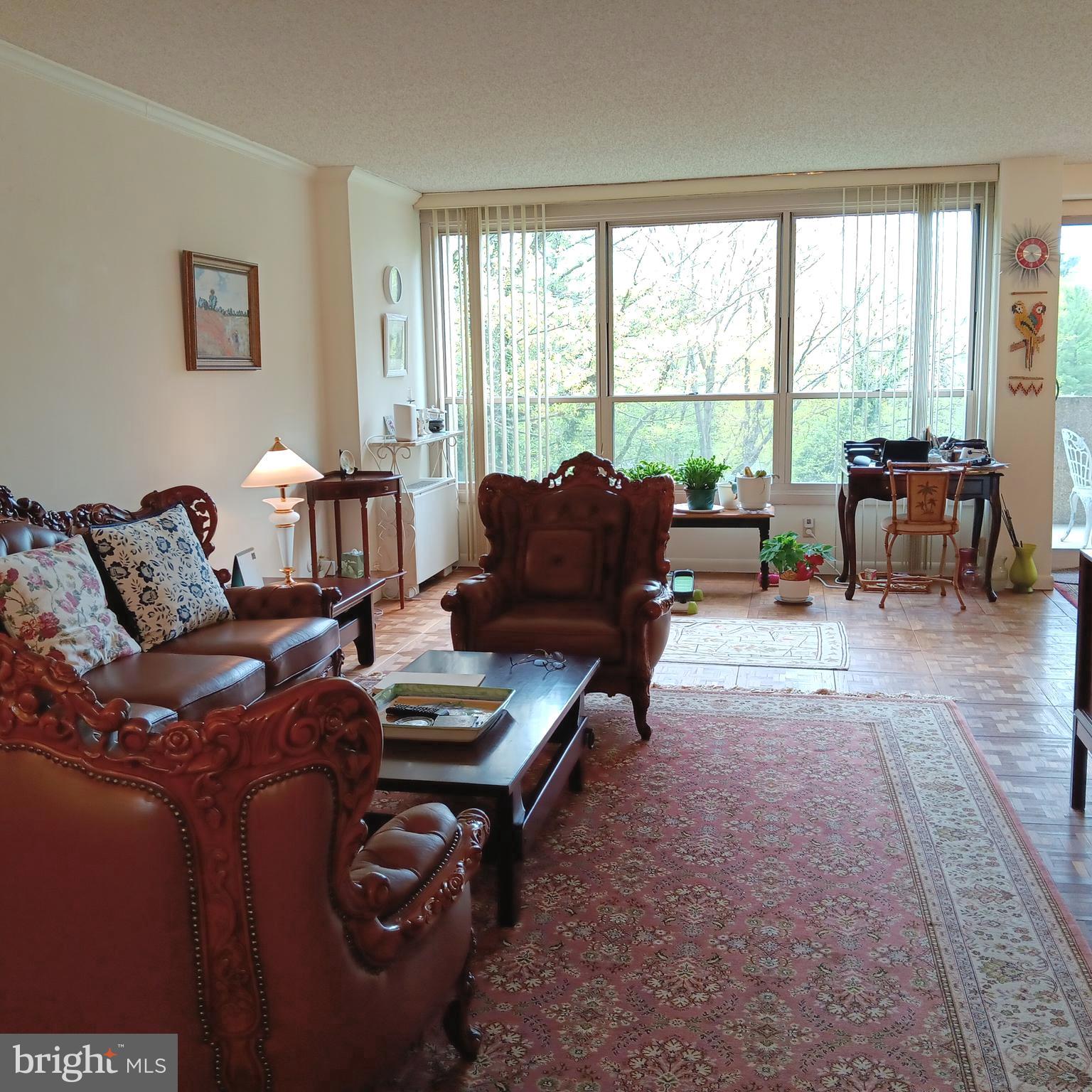 A 2-bedroom unit on the 4th floor of East Building in that all famous Green Hill Condo, or known as 1001 City Ave. Located on a bright side with a balcony off dining room overlooking open space and wonderful views: This is why the current owner chose to buy this unit. Mosaic-type real Hardwood Floors. Not all that fancy updates, but everything is in good working order. In this community, condo fees cover almost everything from ground maintenance, tennis court, 24/7 door man and onsite management to water, sewer and electricity. Other than small fees for use of  the indoor pool, outdoor pool and gym, the only item you need to pay out of your own pocket is internet/cable TV. The Greenhill shuttle service is available to residents for easy access to shopping centers, grocery stores, Lankenau Hospital and R5 train station to Center City. The social club sponsors trips to the Kimmel Center, theaters and other regional cultural events. If you have school age children, don't forget this condo is in the award winning Lower Merion School district, and you have a choice to send your children to either Lower Merion High or Harriton High. Just one more thing: the current owner has a transferable indoor parking space for $170/month - to avoid summer heat and rain as well as winter snow. They will be happy to transfer it to the new owner.