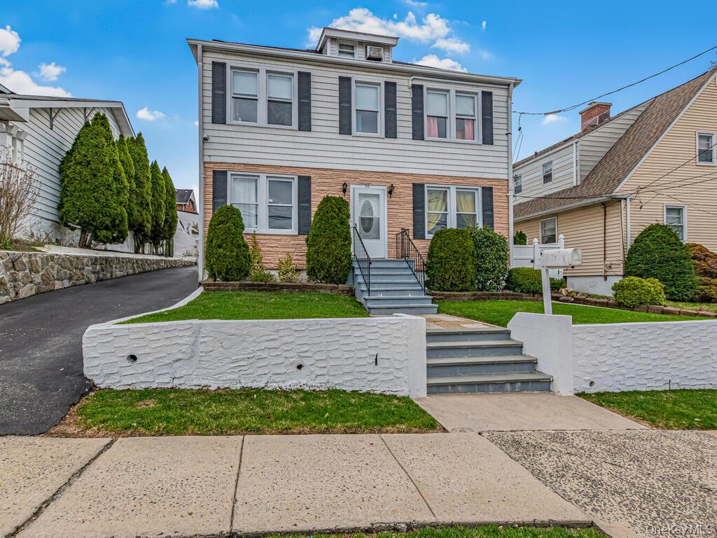 Spacious colonial-style single-family home located in the desirable Bryn Mawr section of Yonkers, sitting on a 50 x 100 lot offering ample space both inside and out. The main level features a foyer, living room, dining area, kitchen, half bathroom, and a family room perfect for everyday living and entertaining. The second level offers an extremely large primary bedroom created by combining two rooms, along with three additional bedrooms and a full bathroom. The third level features a walk-up attic with a large open space, ideal for extending living space or creating a home office, gym, or additional bedrooms. The finished walkout basement offers even more flexibility with an open layout, kitchenette, and full bathroom, ideal for extended living or recreation. Additional highlights include solar panels, a two-car garage, driveway parking, and a private fenced backyard perfect for BBQs and entertaining, including a deck with an above-ground pool. Conveniently located near Tuckahoe Road with access to local shops, eateries, and public transit. Close to major roadways including the Bronx River Parkway, Saw Mill River Parkway, and I-87 (Major Deegan Expressway), providing easy access to New York City and surrounding areas. Nearby Ridge Hill Mall featuring retail stores, dining, and everything needed for everyday convenience.