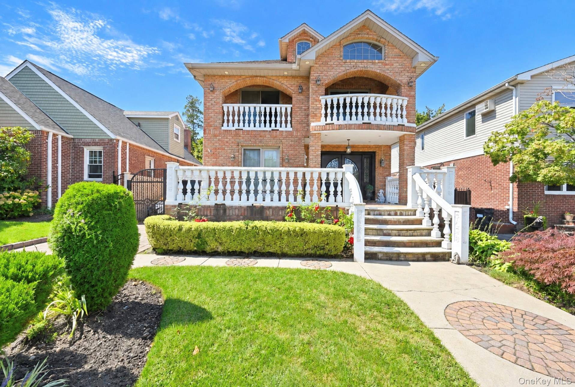 Newer brick colonial situated on a beautiful tree-lined street in a PRIME BAYSIDE LOCATION! Location! Location! This quality-built 3-bedroom, 3.5-bath home offers modern construction with classic appeal. Open floor plan with formal living/dining, eat-in kitchen, and finished basement with half bath. Second floor offers 3 bedrooms, 2 full baths, and 3 balconies. Central heat/AC (2 zones), 1-car garage, separate hot water heater. Private backyard with swimming pool. Excellent School District 26. 40' x 100' lot. Move-in ready!