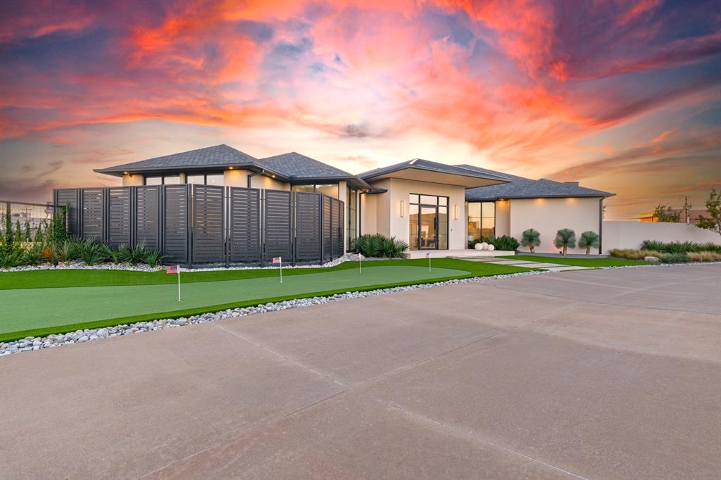 Flawless design. Effortless living. Prime location.

Located in Gaillardia’s exclusive Promenade section, this single-level contemporary home blends sophistication, comfort, and convenience. Just minutes from the neighborhood gate, highway access, and popular local restaurants, it delivers luxury living with everyday ease.

Spanning nearly 4,000 square feet, the home includes two primary suites and a powder bath. High ceilings, Western Steel windows and doors, and heated tile floors create a warm, modern feel, while spray foam insulation, 5/8 fireproof sheetrock, and a whole-home generator add efficiency and peace of mind.

The kitchen is a true showpiece with Taj Mahal quartzite countertops, custom cabinetry, under-cabinet lighting, and Wolf appliances including a built-in gas range, electric oven, outdoor grill, and pizza oven. A Miele coffee machine, Sub-Zero refrigerator, and wine fridge complete this impressive space designed for entertaining and everyday living.

A wall of glass opens to a resort-style patio with A/C, infrared heaters, remote-controlled screens, and a double-sided fireplace inspired by the Omni Hotel downtown. The yard features Astroturf, a putting green, and Palm Springs–style landscaping with drip irrigation and color-changing lights for events and holidays.

Additional highlights include two tankless water heaters, three HVAC zones, LED lighting throughout, a safe room, epoxy-coated garage floors with a modern glass door, and ceiling speakers that connect to your playlist. Full smart-home integration allows you to manage everything from your phone, including the stereo, TVs, pool, alarm, cameras, Ring doorbell, and generator.

Exterior maintenance is included in HOA dues, and 24/7 manned gate security provides peace of mind. A home where flawless craftsmanship meets timeless design — the best of Gaillardia living.