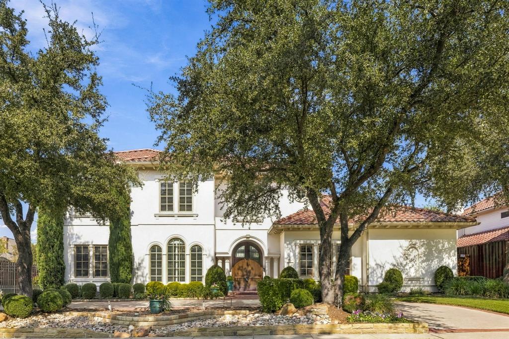 Live the resort lifestyle in this Robert Balkman Mediterranean on a .3-acre lot with nearly 6,500 sq ft, a circular drive, updated landscaping, and a gated motor court in Lakeside on Preston—minutes from Gleneagles Country Club, HEB, top schools, and Legacy West. Curved wood double entry doors reveal 28-ft ceilings, a fireplace, and a soaring wall of windows, flowing into a fireside family room with a wet bar and wine fridge. At the heart of the home, the kitchen is an epicurean showpiece with sprawling granite counters and an island where everyone naturally gathers. Custom cabinetry encases culinary power with a Thermador 5-burner cooktop, GE Cafe double ovens, and a Bosch dishwasher. Grab a chilled drink from the beverage fridge, pour crisp water from the 5-stage RO filter system, or host effortless dinner parties through the granite butler’s pantry into the dining room, flanked by a walk-in pantry, study nook with built-ins, and a breakfast nook by the back staircase. The executive study features rich wood paneling, coffered ceilings, and built-ins. Unwind in the main-level primary retreat with electric shades, a pool-view sitting area, and a double-sided gas log fireplace warming both the bedroom and a spa bath with dual marble vanities, hydrotub, dual shower heads, and a custom closet. Secondary bedrooms all feature generous walk-in closets, including an updated 1st-floor guest suite with new paint and flooring. Upstairs media room boasts a projector and 100' TV, and a game room with a wet bar, fridge, and flex gym-storage space. Step outside to a private paradise: a Riverbend Sandler completely remodeled heated pool & spa with new surfaces, putting green, fire pit, pergola, and outdoor kitchen with 6-burner gas grill, sink, Big Green Egg, and fridge. Complete with a dog-wash utility room, whole-house surge protection, Ring Pro monitoring with safety sensors, fresh paint, and a community pool, lake fishing, tennis, and the Silver Creek Walk.