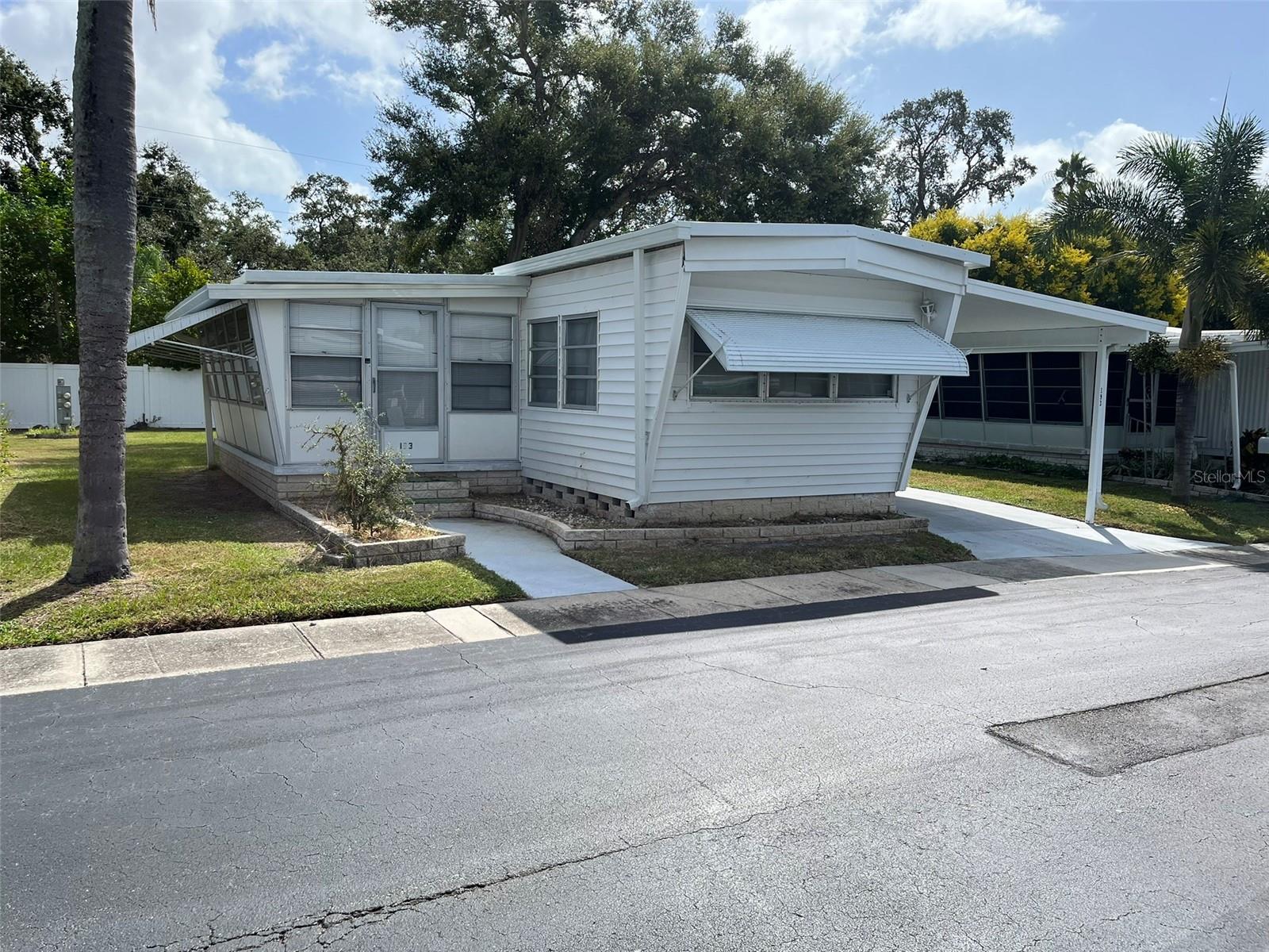 Fractional Ownership. Winner of the "Best of Dunedin" 2025 Award in Mobile Home Parks. Located 3 miles east of the Gulf of Mexico in Dunedin , Florida and .8 of a mile from the inter-coastal waterway, Golden Acres occupies 23.38 acres of prime property off of Main Street and Patricia Avenue with 224 mobile units. We are a resident owned (RO) park , meaning that when you purchase a share you own 1/224 of the park. You are part of a co-operative, with each owner having their own equal share of the park. The purchase price includes the share ($23,800) plus the cost of the coach. A Monthly Maintenance FEE of $210 covers other costs and amenities.
Facilities include an outdoor heated pool, recently renovated clubhouse with wireless, shuffleboard courts, wood-hobby shop, billiard room, and laundry facilities. An active, 55 plus, no-pet community offers a full range of recreational activities. Exercise classes, potluck dinners, cookouts, outings, golf courses nearby, and a full calendar of events are planned by the Recreation Committee. Sign ups 
are in the clubhouse. Available for residents are clubs, a golf league, shuffleboard league,cards, and more. Monthly calendars are in our printed distributed newsletters or the clubhouse. Our Beautification Committee is responsible for keeping the parks flower beds and entryway looking fresh and colorful as well as Christmas decorating.