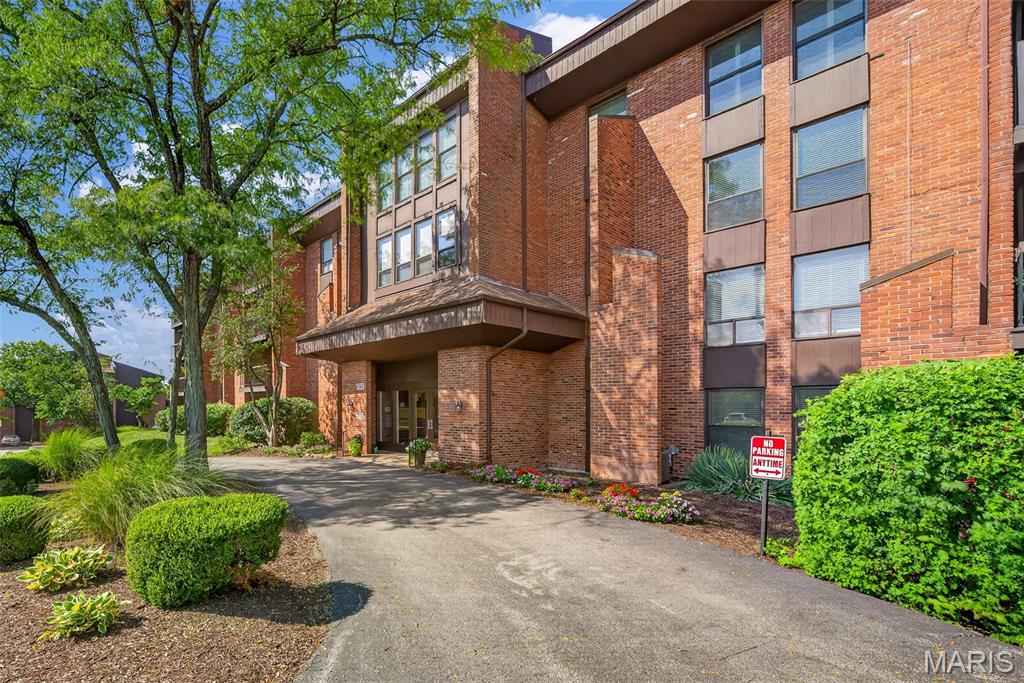Beautifully upgraded main floor condo in the heart of Creve Coeur  Unit comes with 2 secure garage parking spots. Family room has upgraded can lighting & woods floors. Private covered balcony off the family room provides an inviting space to relax. The dining room has space for an 8-10 person dining table, china cabinet, & buffet. Kitchen boasts: wood cabinets w/ pull outs, granite counters, sleek tile backsplash, double ovens, cook top, step-in pantry, & the option to have an island with seating. Large primary suite has a room sized walk-in closet. Go ahead & shop you have the space! Primary bath has been updated with a  step-in shower & grab bars have been installed. 2nd bedroom w/ triple door closet is perfect for an office or guest suite. 2nd full bath is adjacent to this room. Additional features: Engineered hardwood floors, in-unit laundry closet, newer windows, plantation shutters, can lighting added, newer HVAC, STL closet systems in primary closet, multiple closets in the entry foyer & hall, & additional open parking. Complex amenities include: pool, tennis court, club house, & green space. Prime location close to Olive & 270, walkable to Panera, minutes to grocery stores and many restaurants.