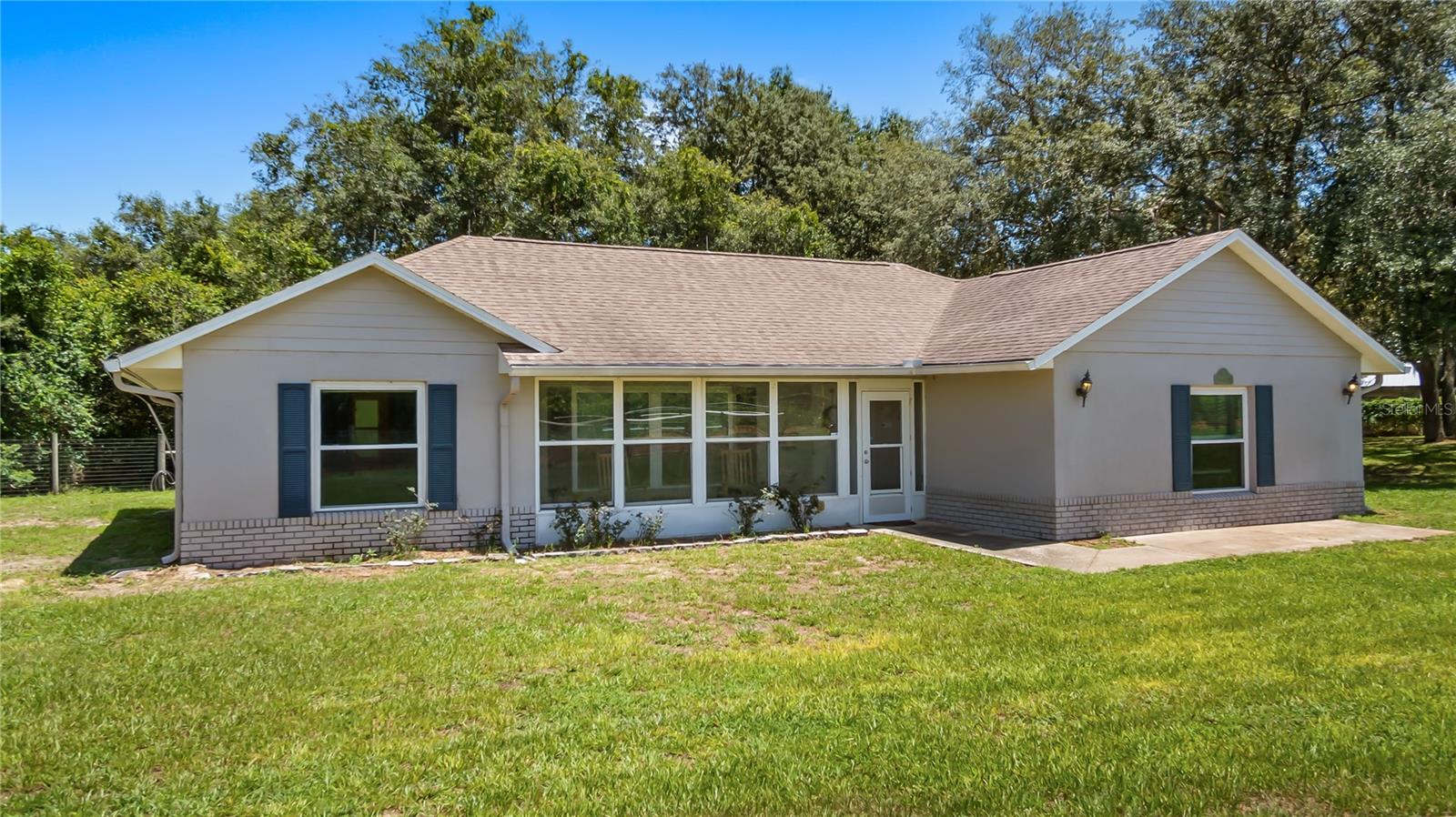 Little Piece of Country Living with NO HOA! Sitting on almost two acres,  Completely Fenced. This Well Maintained Home will not Disappoint! Features include: *4 Bedrooms *2 Baths, Tile Throughout, *interior paint (2019) *Roof 2016 *New Double Pane Windows (2021) *Newly Painted Exterior (2021) *Interior Paint (2019) *Both Bathrooms Updated  *New Drain-field (2018) *20 X 24 Metal Outbuilding w/Electric, pad and RV hookup. Close to New Minneola Turnpike Exit.  Family room (4th bedroom)19 X 19.  Enclosed 4 X 20 Front Porch, Screened back porch.  County maintained Road. Newer appliances, interior walls insulation is spray foam.ADDITIONAL PICTURES SOON!!!