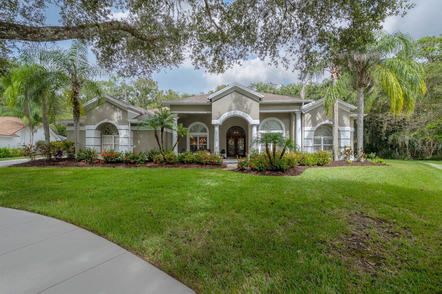 Discover your own private oasis at 15801 Dawson Ridge Drive in Tampa, FL. This exceptional 6-bedroom, 4.5-bathroom home offers a generous 4,544 square feet of living space on a 17,876 square foot lot. Inside, you're welcomed by beautiful hardwood floors and a chef's kitchen, with Thermador appliances, a kitchen island, and stunning new quartz countertops. The cozy breakfast area and family room, with built-ins and a dry bar featuring a wine refrigerator, are perfect for entertaining.

The formal living room, with elegant French doors, opens directly to the pool area for seamless indoor-outdoor living. A tranquil private office provides a peaceful workspace. The expansive primary bedroom boasts a luxurious ensuite with a walk-in shower and a soaking tub.

Outdoors, enjoy a private pool, outdoor kitchen, and ample space for relaxation, all with sweeping, unobstructed conservation views—your very own sanctuary. This split open concept plan includes a versatile in-law suite with its own pool entrance and private bath. Situated in a quiet, welcoming neighborhood, you're just minutes from parks, shopping, dining, and more. Tampa Palms offers a well-planned community with sidewalks and access to outdoor activities. More than a house, this is a place to relax and recharge. Welcome home!