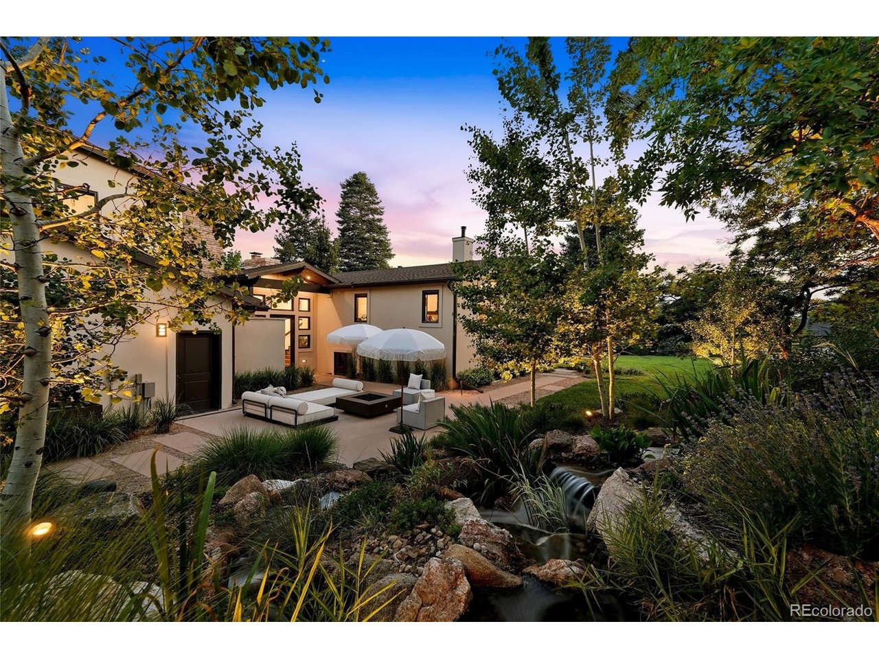 Set on one of Orchard Hills' park-like 0.55-acre lots, this exceptional Greenwood Village residence is more than an extensively renovated home- it's an evolution of one of the neighborhood's original architectural ideals.Expanded and reimagined with purpose by Marc David Homes, the property has benefited from more than $1.3 million in upgrades since 2021, every improvement honoring the home's architectural roots while creating a residence that reflects an enduring philosophy of intentional design. The result is over 4,300 square feet offering six bedrooms, a dedicated office, four-and-a-half baths, and a private guest wing with two bedrooms, full bath, and loft- ideal for extended guests or a secluded retreat. While the home's gathering spaces invite connection, the primary suite offers quiet sanctuary, where a cedar-clad vaulted ceiling, fireplace, spa-inspired bath with soaking tub, steam shower, and custom walk-in closet create an atmosphere of understated luxury.Light-filled living spaces flow effortlessly to a gas-heated covered deck overlooking professionally designed grounds by Alex Ostblom (Branch Landscape Group). Mature trees, a custom waterfall feature, dual outdoor sound systems, gas fire table, and multiple outdoor living areas with architectural landscape lighting create an atmosphere that feels both expansive and remarkably private.Originally envisioned by renowned planner Eugene Sternberg, Orchard Hills was designed as a departure from the conventional suburban neighborhood- preserving the natural landscape through winding streets, expansive greenbelts, mature tree canopies, and oversized homesites that foster privacy and a lasting connection to nature. Decades later, that vision remains one of Greenwood Village's best kept secrets. Moments from Cherry Creek schools, parks, trails, DTC, and light rail-this is more than a home, it's an opportunity to discover Orchard Hills-one of Colorado's most architecturally distinctive neighborhoods.
