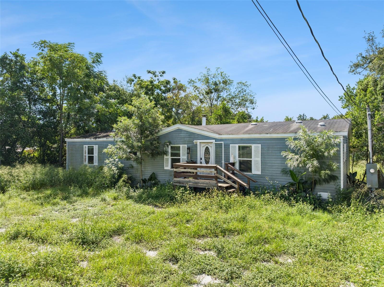 Priced to Sell – Handyman Special! Spacious property situated on a large double lot, offering plenty of room and potential. (Buyer/Buyers agent may check with the county regarding the possibility of a lot split).The property is fully fenced with a combination of privacy and chain-link fencing. The fencing is in place (some repairs needed) and simply needs gates installed.Additional exterior features include:Wood/metal pole barn which also can be used as a 2-car covered parking area with concrete baseStorage shedStep inside through the front door to an open-concept kitchen and living area. The kitchen features a large island with seating area, granite countertops, and plenty of space for entertaining.The home offers laminate flooring throughout most of the house, with travertine tile in the bathrooms. Granite countertops are featured in both the kitchen and bathrooms. The split-bedroom floor plan provides privacy for the primary suite and additional bedrooms. The spacious primary bedroom features two separate bathrooms, offering exceptional convenience:One bathroom includes a large garden tub, bowl sink, and toiletThe second bathroom includes a walk-in shower, bowl sink, and toiletLarge walk-in closetThe living room features a granite-surround wood-burning fireplace and a convenient coffee bar area.This property offers plenty of space, unique features, and potential for the right buyer. Bring your vision and make it your own!Priced to sell – don’t miss this opportunity! cash only.