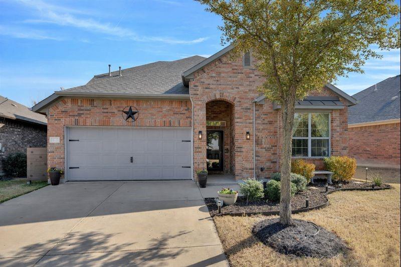 ***OPEN HOUSE SATURDAY, JAN 10, 12-2***Beautifully maintained home in the Roanoke area, located in award-winning Northwest ISD. (Roof being replaced January 2026) This inviting residence offers a smart, family-friendly layout with 3 bedrooms (and flexibility for a 4th bedroom) and 2 full baths downstairs, plus a large upstairs flex room with walk-in closet and full bath—ideal for an additional bedroom, game room, teen space, or guests. Warm, modern finishes and abundant natural light fill the open-concept main living area, featuring beautiful flooring and a cozy fireplace—perfect for everyday living and entertaining. The kitchen opens seamlessly to the living and dining spaces and includes stainless steel appliances, generous counter space, and a breakfast bar overlooking the main living area. A bright dining area with backyard views enhances the home’s welcoming feel. The main level also features an additional flex space ideal for formal dining, home office or sitting area. Enjoy mature landscaping, and a private backyard with artificial turf providing minimal maintenance to allow more time for outdoor relaxation and play. Conveniently located near shopping, dining, and entertainment, with easy access to major highways, this home combines comfort, versatility, and exceptional value in a highly sought-after school district.