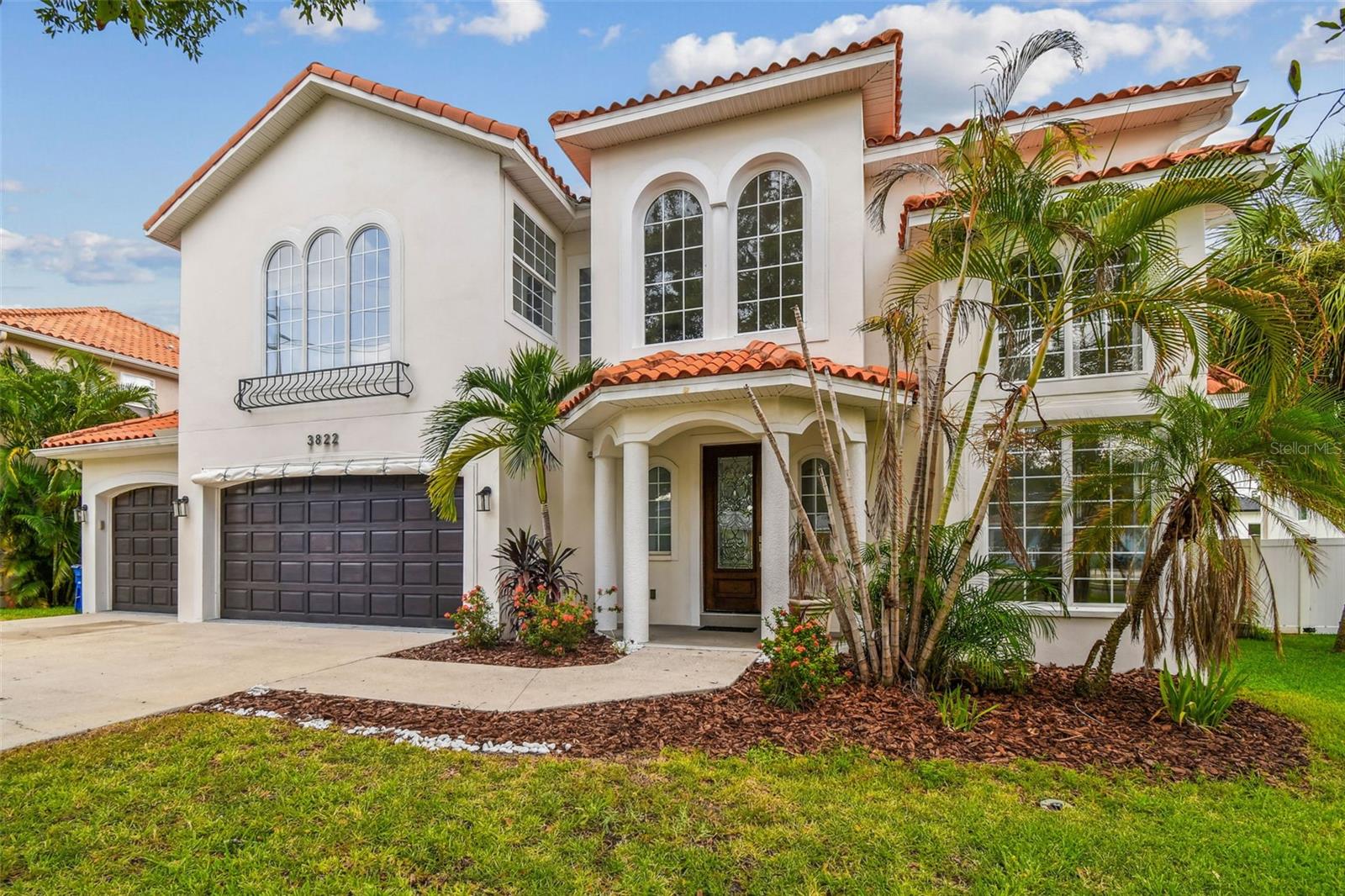 Under contract-accepting backup offers. Luxury Virginia Park Pool Home - This residence blends Mediterranean-inspired architecture with modern comforts in one of South Tampa’s most sought-after locations. Featuring six bedrooms and five bathrooms, the home offers both grand entertaining spaces and private retreats, all framed by soaring ceilings, abundant natural light, and rich wood flooring throughout. A dramatic two-story living room and elegant formal dining area welcome you inside. The gourmet kitchen is outfitted with custom cabinetry, stainless steel appliances, a center island, breakfast bar, and walk-in pantry. The adjoining breakfast area is wrapped in glass, filling the space with natural light and offering serene views of the pool. A spacious family room opens directly to the lanai, creating seamless indoor–outdoor living. The first floor also includes a guest suite with en-suite bath and direct pool access. Upstairs, a private office with walk-in closet provides a quiet work-from-home option. The owner’s suite is a luxurious retreat with dual walk-in closets and a spa-inspired bathroom featuring dual vanities, a freestanding soaking tub, and a separate seamless-glass shower. Three additional bedrooms and two full baths complete the second floor. The outdoor living area rivals a private resort—anchored by a contemporary saltwater pool, custom lounging deck, and expansive screened lanai ideal for dining, entertaining, or simply relaxing in the Florida sun. The privacy-fenced 75x125 lot also includes a three-car garage for convenience and storage. Zoned for A-rated Roosevelt, Coleman, and Plant schools, the home is perfectly situated near MacDill Air Force Base, Tampa International Airport, world famous International Mall, and Tampa’s finest dining and entertainment. Call for your private showing today.