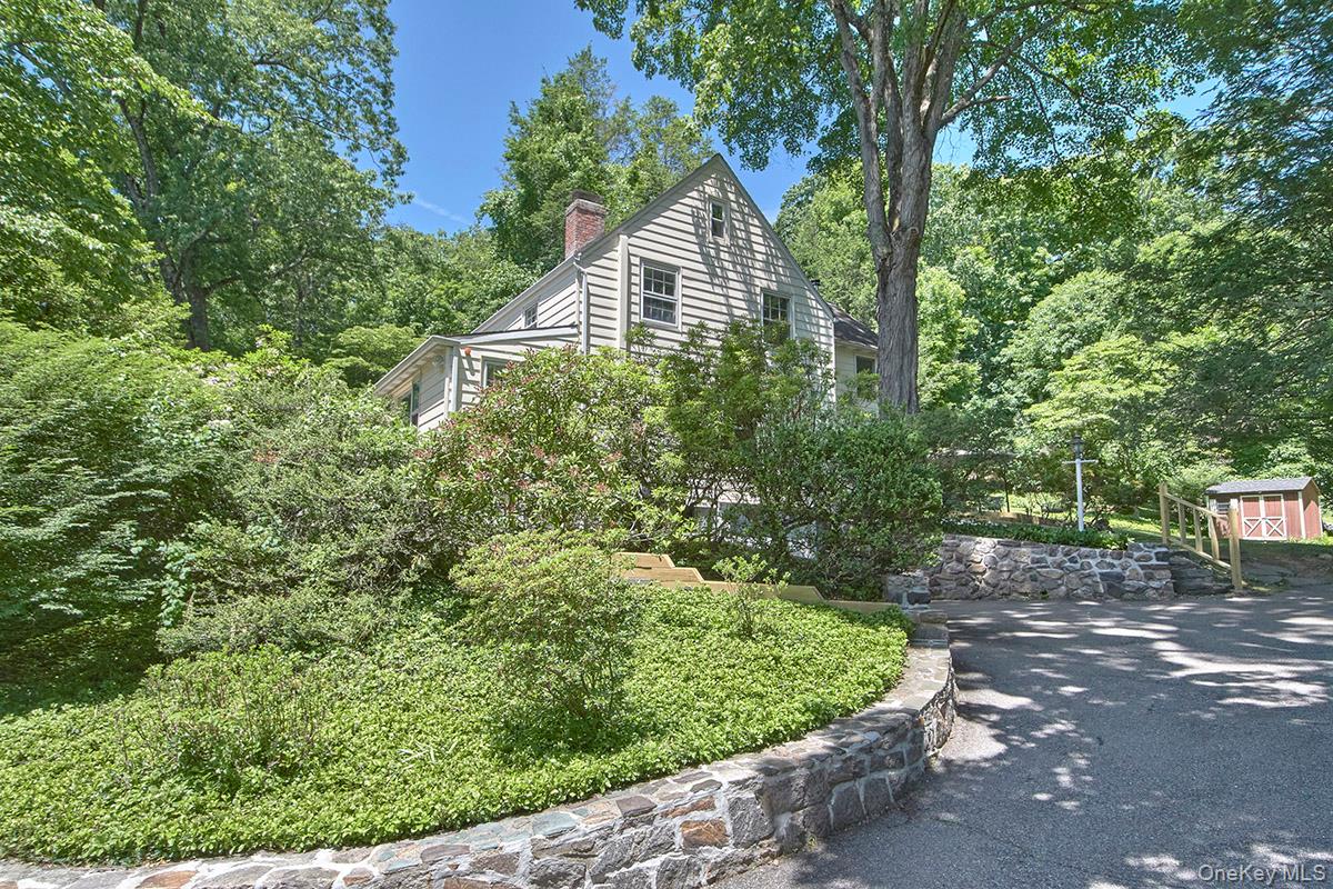 Move right into this sparkling, beautifully updated 4-bedroom Colonial, ideally located in the highly sought-after Chappaqua School District. Blending timeless pre-war charm with modern amenities, this home offers exceptional comfort and style.Freshly painted inside and out, the home features beautiful hardwood floors, recessed lighting, a renovated kitchen, updated bathrooms, a wood burning stove and more . A walk-up attic provides excellent storage or future expansion possibilities.Outside, enjoy a large, private property with mature landscaping and perennial gardens, a usable yard, and an expanded driveway accented by elegant Belgian block edging. Additional highlights include an above-ground oil tank and a convenient location close to schools, shopping, dining, transportation, and all that the area has to offer.A truly turnkey opportunity combining character, updates, and convenience.