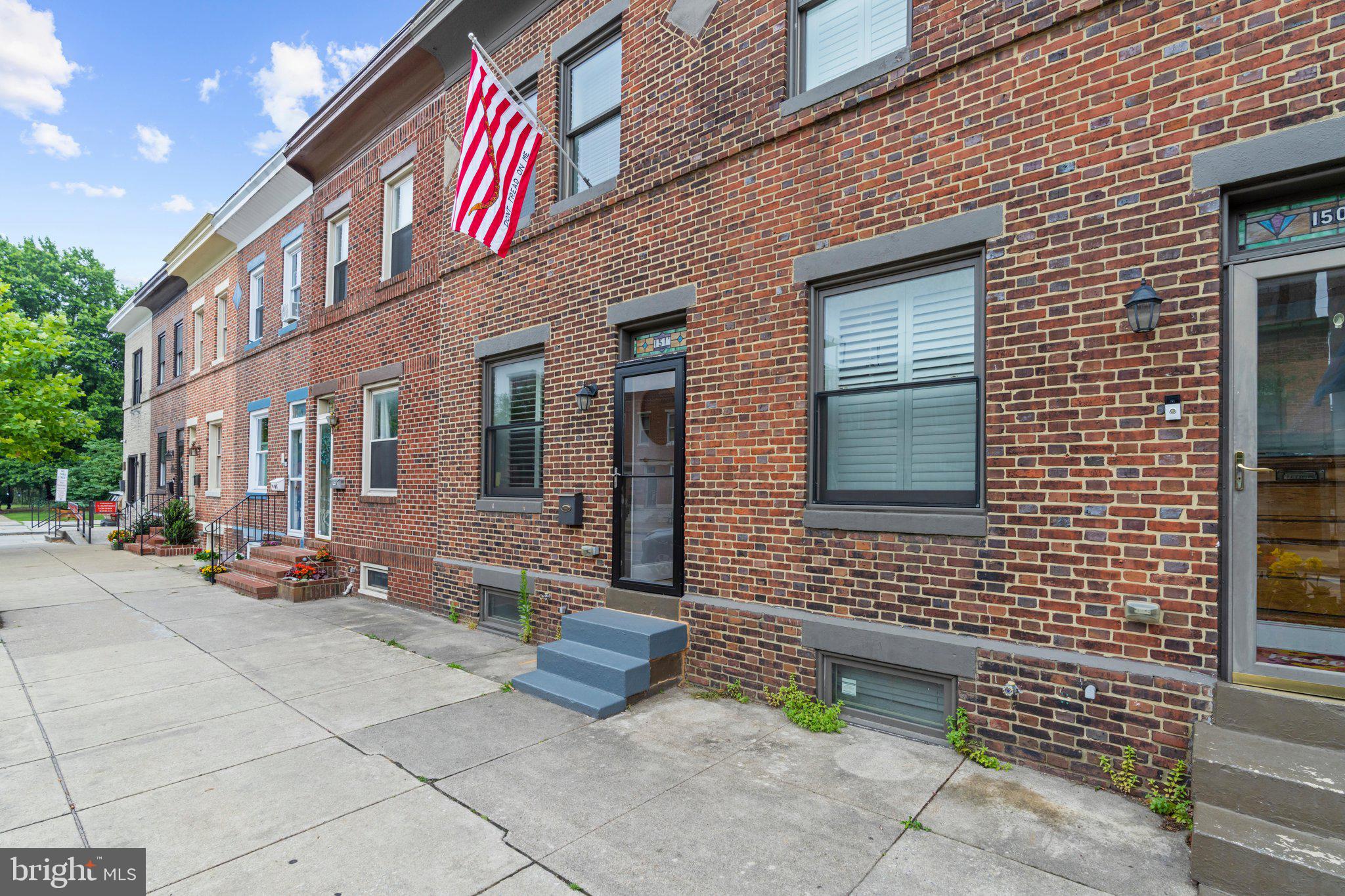 Available now in the heart of Locust Point—just steps from Latrobe Park and historic Fort McHenry! This beautifully renovated 3-bedroom, 3-full-bath row home offers 1,556 sq ft of stylish living where original 1905 character meets modern comfort. Enjoy original hardwood floors, exposed brick throughout, and a bright, open floor plan. The gourmet kitchen features gray quartz counters, white cabinets, subway tile backsplash, and stainless steel appliances. Upstairs, the primary bedroom has its own private bath, with a second bedroom and full hall bath completing the level. The finished basement adds flexible bonus space—perfect for a home office, gym, or den. Rare city perk: your own private off-street parking pad. Walk to Harris Teeter, top restaurants, and local shops in one of Baltimore's most sought-after waterfront neighborhoods. Schedule your tour today!