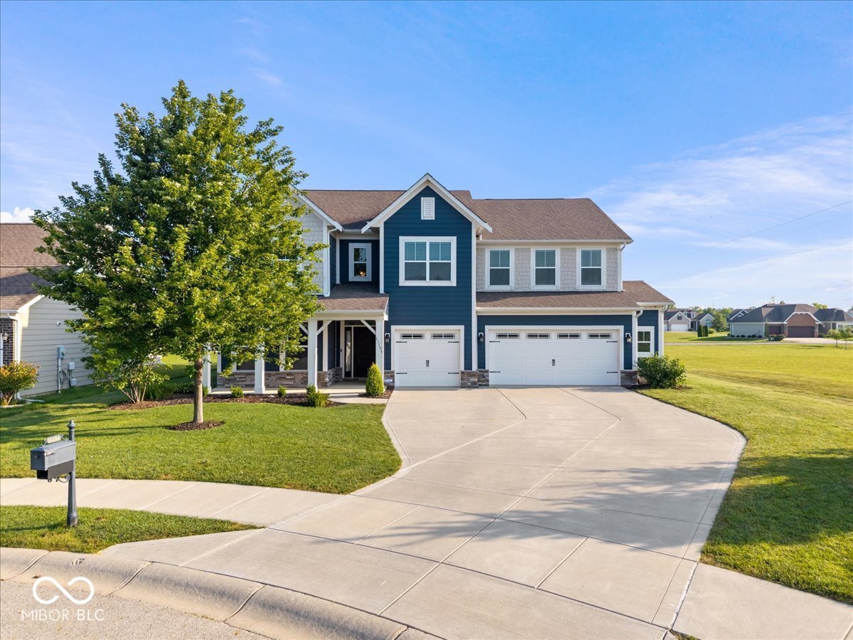 Picture this: a quiet cul-de-sac, a front porch made for morning coffee, & a backyard that opens up to wide-open green space & the future Copper Trace Trail. If that sounds like the perfect start to your day, wait until you see the rest of this home.  Step inside & you'll immediately feel the warmth of the vinyl wood floors & the airy, open layout. The showstopper is definitely the great room-sunlight streams in through massive windows, highlighting a 20-foot stacked stone fireplace that stretches all the way up to the coffered ceiling. It's the kind of spot where you'll want to kick back and stay a while. The kitchen is a total dream for anyone who loves to host. We're talking a huge center island, granite countertops, double ovens, & a walk-in pantry that can handle even the biggest grocery runs.  Need a dedicated workspace? There's a bright office right off the foyer. Looking for a spot for hobbies, play room, or a cozy secondary lounge? The main-floor flex room has you covered. Even the mudroom is thoughtfully designed with built-in cubbies to keep life organized as you head out to the three-car garage.  Upstairs, you'll find four bedrooms, & yes-every single one has its own walk-in closet. The primary suite is a total getaway, featuring tray ceilings & en-suite bath with a beautiful tiled shower. The primary closet is a highlight all on its own, complete with a custom center island.  We've also tucked in some tech that makes life a breeze. The garage is already set up with a 220V outlet for your EV charger, & the entire house is pre-wired for a seamless home network. Best of all? You can cross mowing off your to-do list-the smart electric mower is already programmed to keep the lawn looking sharp while you relax on the Trex-decked patio, surrounded by privacy-boosting arborvitae. It's more than just a house; it's a place that's ready for you to move in & start enjoying life. Onsite amenities include clubhouse, pool, playground & close to Flat Fork Creek Park.
