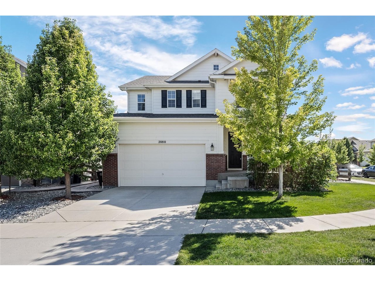 A corner lot in Somerset Meadows with mountain views out front and a new city park directly across the street. Clover Meadows opened recently, three more parks sit within a half mile, and the walking paths nearby run west until they meet Boulder County's dirt roads. The Diagonal is four minutes out, which keeps the Boulder commute short.Inside, nine-foot ceilings and luxury vinyl plank carry the main level. Three walls of windows keep the great room bright through the afternoon, and a gas fireplace anchors the far end.The kitchen sits open to both the dining and living areas, with a long island and seating along one side, solid surface counters, a gas cooktop, double wall ovens, stainless appliances, and a walk-in pantry.The dining room slides open to a fenced yard, a stamped concrete patio and fifteen trees planted last year.Upstairs holds three bedrooms plus a separate enclosed office with large windows facing the Front Range. The primary suite has two walk-in closets and a bath with dual vanities, a walk-in shower, and a private water closet. Laundry is on the same floor, washer and dryer included.The daylight basement is stubbed for a bath with egress windows already in place. A tankless water heater, central air, and an attached two-car garage finish it out.