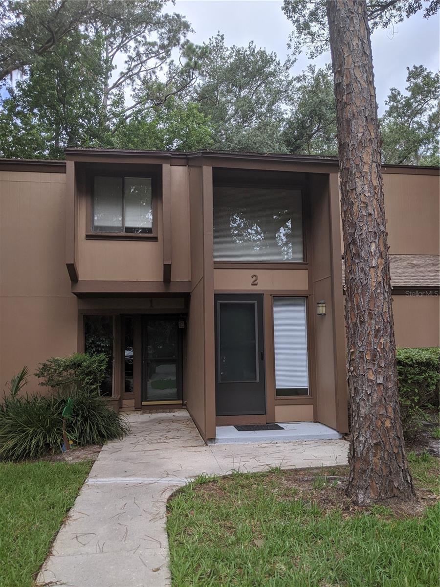 MOVE IN Condition - 2 bedroom 2 bath second floor condo, split plan, granite countertops and upgraded bathrooms.  Interior has recently been painted.  Enclosed Florida room overlooking golf course.  Walking distance to trails, stores (Island Walk Shopping center) restaurants, Daytona College, post office and community center.  Amenities included:  Clubhouse, heated pool and sauna, game room, and tennis courts. HOA approval required.  Background check required by the Association.  Water included, as well as one designated parking spot  Internet is available.