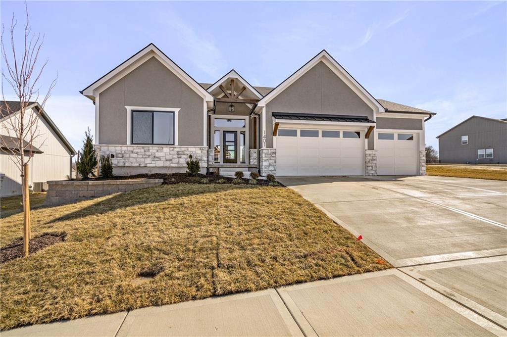 Discover the WOODVIEW II by Walker Custom Homes, a spacious reverse 1.5-story home designed for everyday living and entertaining. The kitchen features stainless steel appliances, a large island, and walk-in pantry, flowing seamlessly into the great room and covered deck. Hardwood floors highlight the entry, kitchen, and great room. The master suite includes a double vanity and generous walk-in closet. The lower level offers two additional bedrooms and a large lounge area, perfect for guests or relaxing. Enjoy Creekmoor amenities, including Lake Creekmoor golf course, clubhouse with fitness center, restaurant/bar, pools, tennis and sports courts, and walking trails. The home includes a yard irrigation system and backs onto the Creekmoor Championship Golf Course.