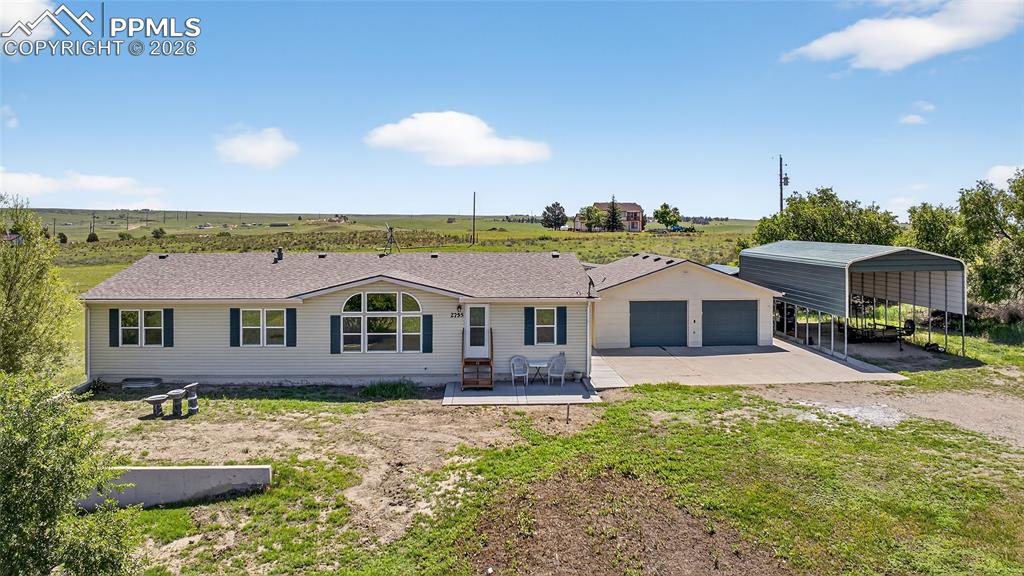 Discover the perfect blend of space, comfort, and scenic beauty with this beautifully updated home, nestled on 5 sprawling acres with stunning mountain views. Boasting over 2,400 sq. ft. on the main level, this property offers wide-open living spaces both inside and out.Step into a huge living room, ideal for entertaining or simply relaxing while taking in the serene surroundings. The large kitchen features granite countertops and flows seamlessly into a formal dining room, creating the perfect setting for gatherings. The spacious primary suite offers a private retreat with a sitting area and attached bathroom.Thoughtful updates throughout include brand new remodeled bathrooms, fresh interior paint, new LVP flooring, newer upgraded carpet, and all new doors and trim. Central air ensures year-round comfort.The wide-open unfinished basement offers endless possibilities—expand your living space, create a home gym, or design the space to fit your needs.Outside, the property is equally impressive with mature trees, a detached two-car garage, an additional RV carport, and multiple storage options—providing ample space for vehicles, equipment, and hobbies.Whether you’re looking for room to roam, breathtaking views, or a move-in ready home with potential to grow, this property delivers on every level. Don’t miss this rare opportunity to own your own private slice of Colorado paradise.