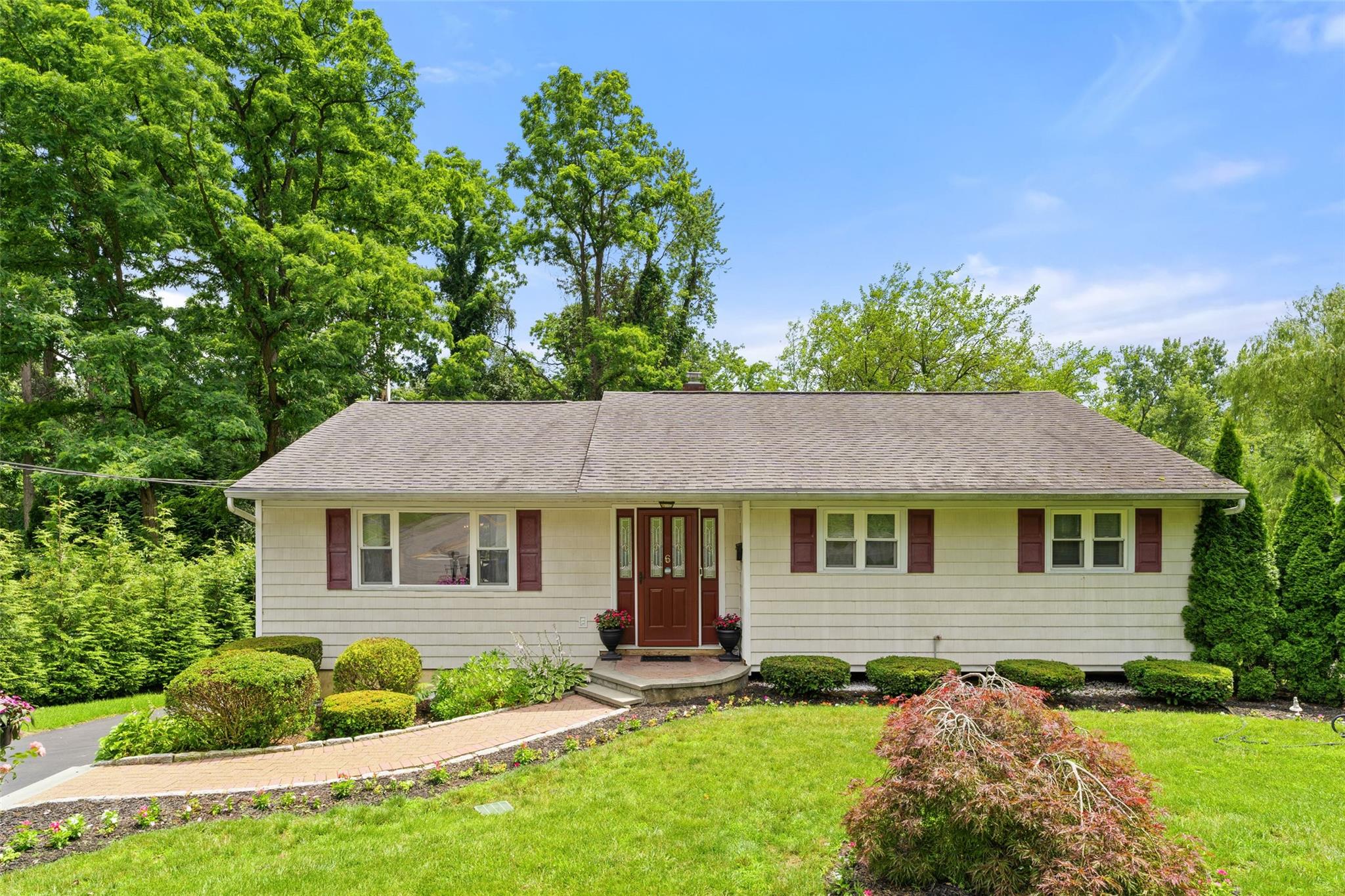 Welcome home to 6 Andover Road! This lovingly maintained 3-bedroom, 2-bath ranch exemplifies pride of place. Ideally located on a quiet, tree-lined street in the College Corners section of Hartsdale, 6 Andover will win your heart. This sun-filled home offers the perfect blend of comfort, convenience, and one-level living—ideal for anyone seeking an easy lifestyle in a prime Westchester location. Step inside to a spacious and sun-filled living room, perfect for relaxing or entertaining. The seamless flow into the eat-in kitchen and formal dining room makes this home perfect for both everyday living and entertaining. From the dining room, sliding glass doors lead to a large outdoor deck, offering the ideal space for al fresco dining, hosting gatherings, or simply enjoying quiet moments year-round. The primary bedroom suite boasts an ensuite bath for added privacy, while two additional well-appointed bedrooms and a full bath complete this level. The lower level offers a large rec room and laundry room, as well as additional space for a mudroom/office. The 2-car tandem garage and driveway provide plenty of parking. Outside, the large level backyard and expanside patio are perfect for relaxing, gardening, or entertaining. Just minutes from the Hartsdale Metro-North station, shopping, dining, parks, and major highways—this home truly has it all. Move right in and start enjoying the best of suburban Westchester living!
