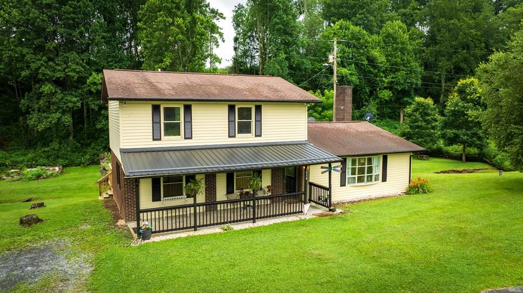 Escape the hustle and embrace the tranquility of country living in this well maintained 3-bedroom, 2-bathroom home sitting on just under an acre.The primary suite is conveniently located on the main level, along with the laundry room. Two additional bedrooms upstairs provide space for family, guests, or a home office.Step outside to enjoy the sounds of the backyard creek and a sprawling yard dotted with mature fruit trees to include: apple, pear, cherry, and plum. The home has several updates such as: new paint inside and out, new gutters, new porch roof, new hot water heater, new pressure tank, new roof for the chicken coop, new dishwasher & stove, new building on the deck for storage and more! Whether you're looking to simplify or raise a family in the fresh country air, this property provides room to grow, breathe, and live the lifestyle you've always wanted.