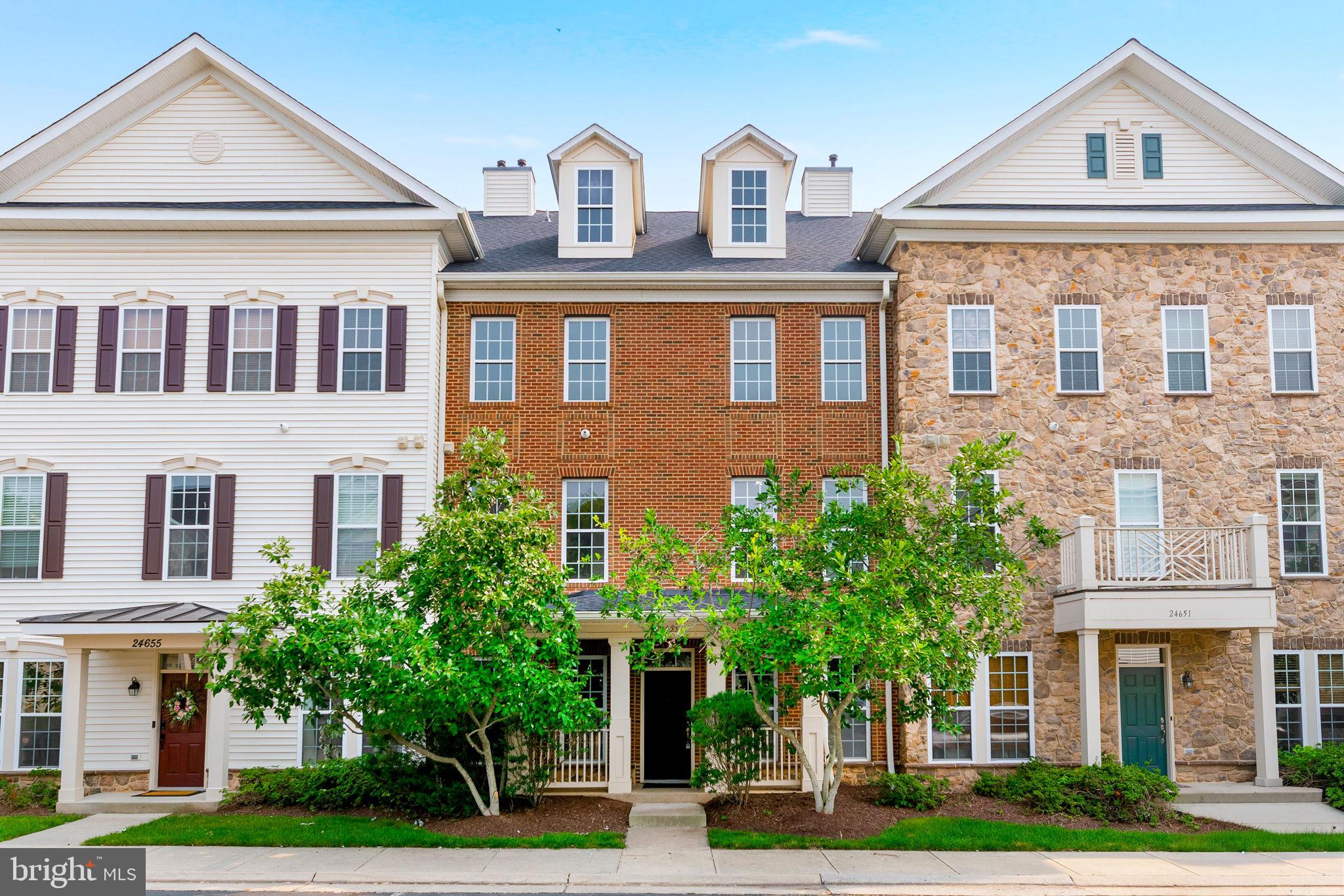 Welcome to this beautifully updated, like-new condominium located in the highly desirable Stone Ridge community, where luxury, convenience, and exceptional amenities come together. Thoughtfully refreshed from top to bottom, this move-in-ready home features fresh paint throughout, all-new carpet, newly installed designer light fixtures, updated door hardware, and custom touches that create a modern, elegant feel from the moment you step inside.The main level offers an open and inviting floor plan designed for both everyday living and entertaining. The spacious family room features a cozy gas fireplace and flows seamlessly into the dining room, highlighted by custom trim details that add warmth and character. The gourmet kitchen is the centerpiece of the home, offering granite countertops, an abundance of cabinet space, and plenty of room for meal preparation and gathering with family and friends. The main level also includes a convenient full laundry room, an updated powder room, and direct access to your private one-car garage.The entire second level is dedicated to an impressive primary suite that truly feels like a private retreat. This oversized sanctuary features a spacious sitting area perfect for reading, relaxing, or creating a second office space, along with two large walk-in closets, including one with custom built-in organizers. The luxurious primary bathroom is designed with comfort in mind and includes dual vanities, a soaking tub, separate walk-in shower, and a private water closet.The upper level continues to impress with a versatile loft overlooking the home, ideal for a home office, study area, playroom, or additional lounge space. Two additional generously sized bedrooms share a large full bathroom, offering ample space for family members or guests. Every room throughout the home is exceptionally spacious, providing a comfortable and functional layout rarely found in similar properties.Living in Stone Ridge means enjoying one of Loudoun County's premier amenity-rich communities. Residents have access to a clubhouse, resort-style swimming pool, fitness center, basketball and tennis courts, dog park, playgrounds, jogging and walking trails, and beautifully maintained common areas. Best of all, this home is located directly across the street from many of these outstanding amenities, making it easy to enjoy an active lifestyle.Outdoor enthusiasts will appreciate nearby Byrne Ridge Park, a 26-acre park offering an ADA-accessible multi-purpose trail, sports fields, batting cages, picnic areas, and expansive green space. Everyday conveniences are just minutes away, including grocery stores, restaurants, cafés, shopping, and the Gum Spring Library, while the Dulles South Recreation & Community Center provides even more recreational opportunities.Commuters will love the exceptional location with quick access to Routes 50 and 28, the Dulles Greenway, and Washington Dulles International Airport. The nearby Stone Ridge Park & Ride provides convenient commuter bus service to Metro stations, Rosslyn, Crystal City, and Washington, D.C., making travel throughout Northern Virginia and into the city remarkably convenient.Offering like-new condition, generous living spaces, luxury finishes, and one of the area's most desirable locations, this exceptional home provides the perfect combination of low-maintenance living and outstanding community amenities. Don't miss this rare opportunity to own one of Stone Ridge's finest residences.
