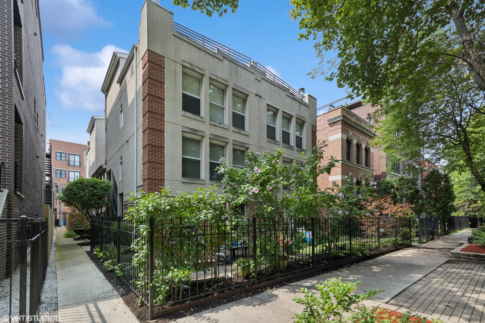 Charming quiet unit with private entrance on tree lined Bosworth Avenue. Large formal living and dining rooms. New laminated hardwood floors that are absolutely gorgeous in the wide plank style running thru the entire home. Corner fireplace adds ambience to movie night or dinner parties. Cook in the oversized kitchen with 42" shaker maple cabinets, stainless appliances, and a walk in pantry. Huge skylight lets in extra light over table area or work space. Foyer, hall closet and an updated bath complete this level. Upstairs there are 2 good size bedroom both with a wall of closets. They connect to the pristine bath with separate tub and shower and double bowl vanities. Washer and dryer plus extra storage add to excellent layout. On the 3rd floor is the bonus room, a perfect place to have a tree top office, exercise, or create extra storage. Huge roof deck with room for seating and grilling and growing your garden. Shed included for storage of cushions or gardening supplies. Walk to all that Diversey has to offer and Southport just a few blocks away with awesome restaurants and bars. Includes 1 assigned parking space. This home in this location can't be beat.