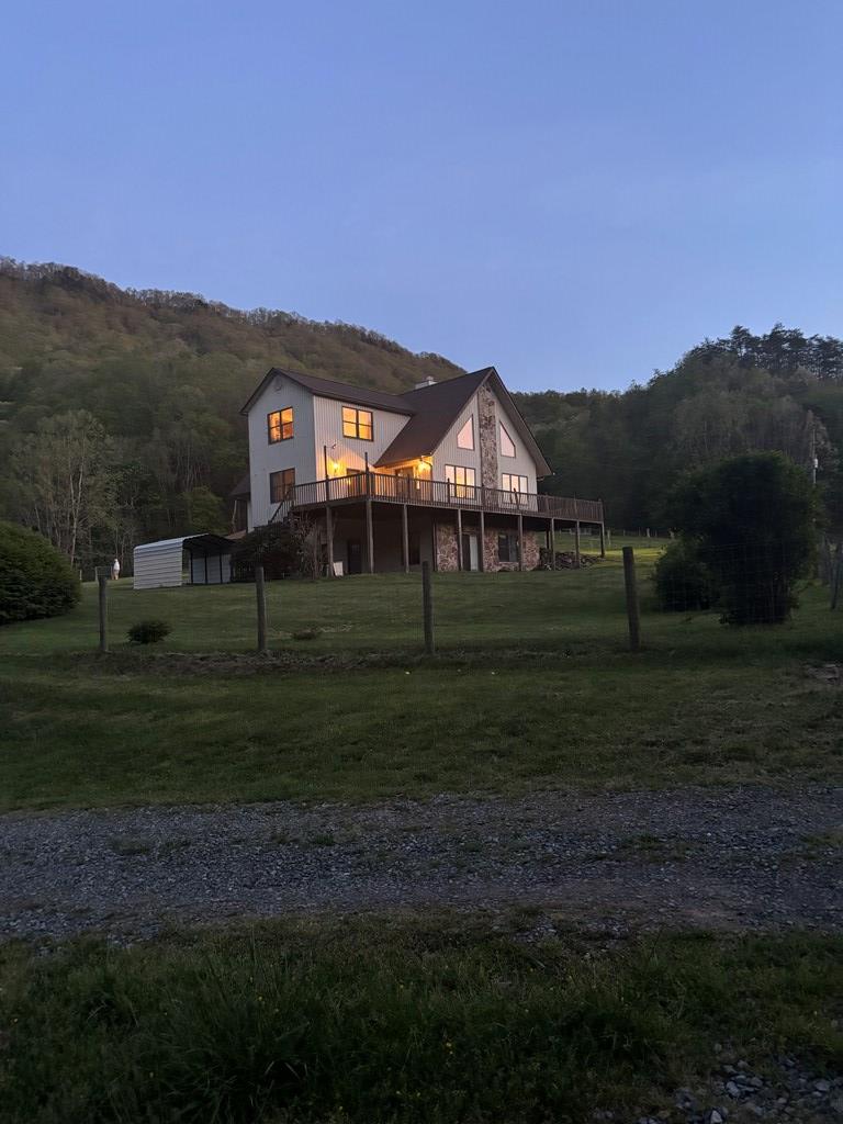 This home is a hidden gem and has some of the most beautiful and private acerage Southwest Virginia has to offer!  The 166 acre farm (approximately 50 acres of pasture) boasts a huge barn and a well built three story modern rustic home with a full apartment on the first floor featuring a woodstove, full kitchen, laundry area, bathroom, bedroom and storage.  The five-bedroom home has a full bath on each level, cathedral ceilings and large windows that perfectly capture the panoramic mountain views.  From the deck you can hear Laurel Creek while looking over some of the most beautiful acerage the Appalachian Mountains have to offer.  The barn measures 36 X 86 ft, and the property has three wells and two gravity fed watering troughs for livestock.  The views, house, and farming potential simply create an incredible mountain home.  The location of this farm will take you back in time when life was simple.  Less than half a mile up the road is a post office open a couple of hours a day and, within walking distance, is a community center offering a playground and paved track.  Also, it has been verified that the property has a rock vein that contains decorative landscaping rock valued at $100,000 - details can be provided upon request.