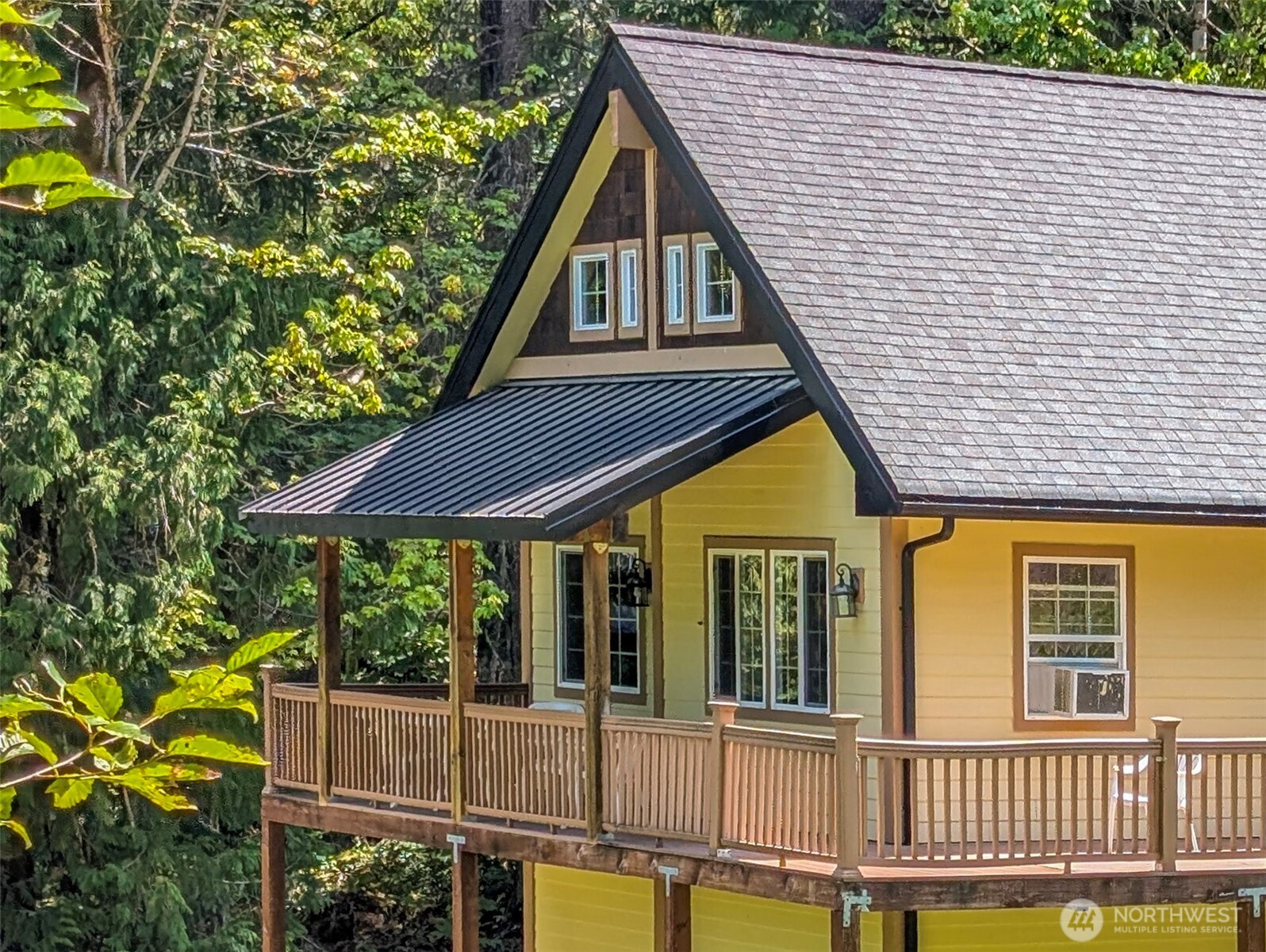 Charming Northwest cabin nestled in Timberline Village, boasting stunning territorial mountain views! This inviting three-bedroom, 1 & 3/4 bath retreat features a cozy fireplace, convenient laundry, and a relaxing hot tub. Enjoy the wrap-around porch that offers serene forest vistas. A spacious, unfinished daylight basement presents excellent expansion opportunities. Timberline community amenities include two outdoor pools, tennis courts, and a clubhouse. Currently thriving as a successful vacation rental, this property is just a short drive from breathtaking Mount Rainier National Park and White Pass Ski Area. Experience the perfect blend of nature and comfort just 2.5 hrs from PDX or SEA & 3 miles from Packwood shops and local breweries!