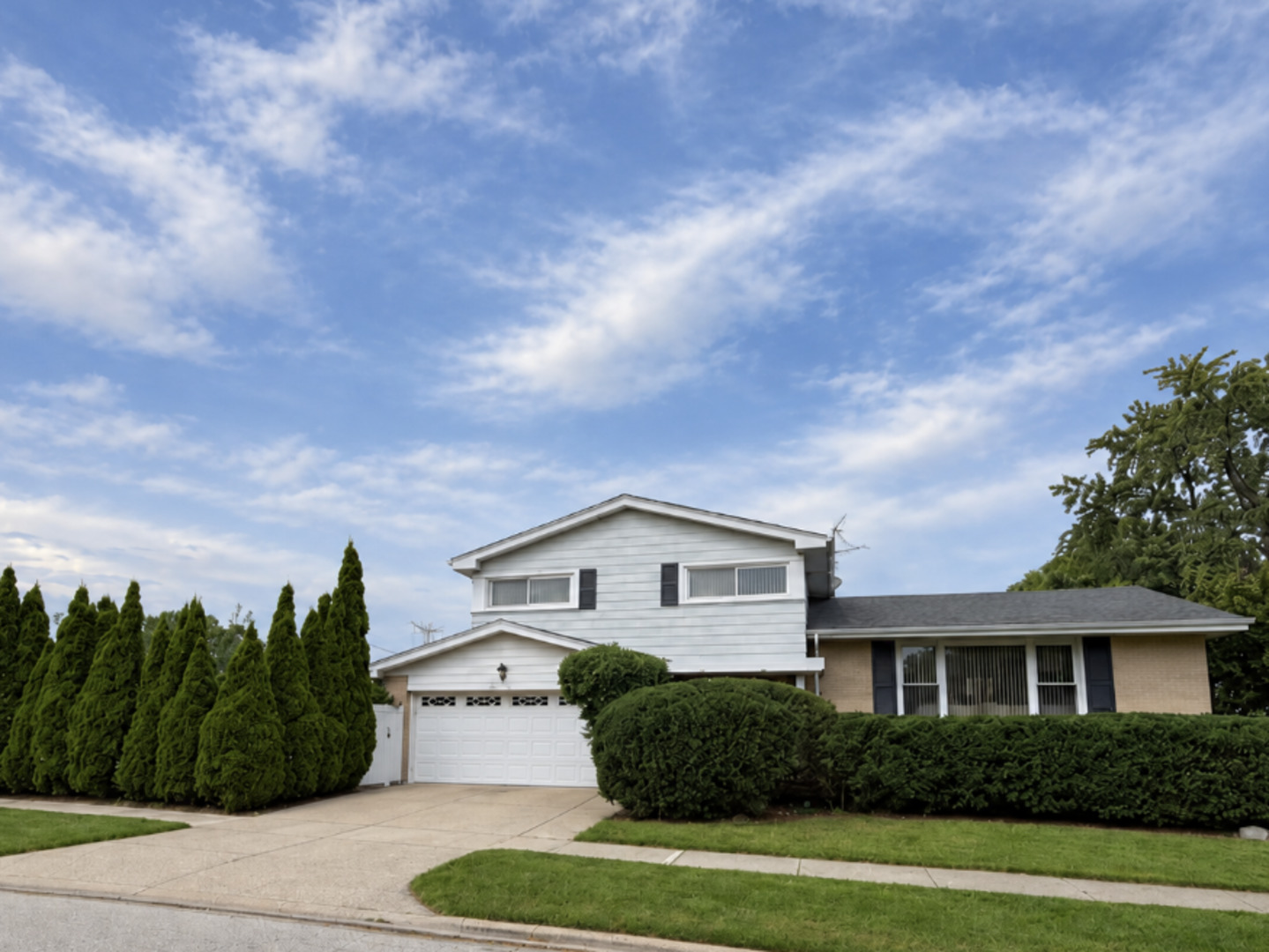 FIRST TIME ON THE MARKET IN NEARLY 40 YEARS-A RARE OPPORTUNITY IN MORTONAIRE! Lovingly maintained and filled with possibilities, this spacious 4-bedroom, 2.5-bath home offers the perfect blend of comfort, flexibility, and room to make it your own.    Set on a beautifully landscaped lot with mature trees, the home welcomes you with bright, generous living spaces and a layout designed for both everyday living and entertaining. The main living area features vaulted ceilings, a dedicated dining space, and an eat-in kitchen with abundant cabinetry, stainless steel appliances, and plenty of room to gather. Upstairs, you'll find three spacious bedrooms, including a private primary suite with its own bath and ample closet space. You will also find a second bathroom in the sun filled hallway. The finished lower level adds incredible versatility with a 4th bedroom, laundry room, and an expansive recreation area ideal for movie nights, a home office, gym, playroom, or entertaining space.    Step outside to a spacious backyard with an enclosed gazebo-furniture included-creating the perfect setting for morning coffee, summer dinners, or relaxing with friends and family.   An attached 2.5-car garage provides even more convenience and storage. Ideally located near shopping, dining, hospitals, major highways, and everyday amenities, this longtime-loved home is ready for its next chapter. Move in, personalize it, and create a home you'll enjoy for years to come. This Property is being sold AS-IS.
