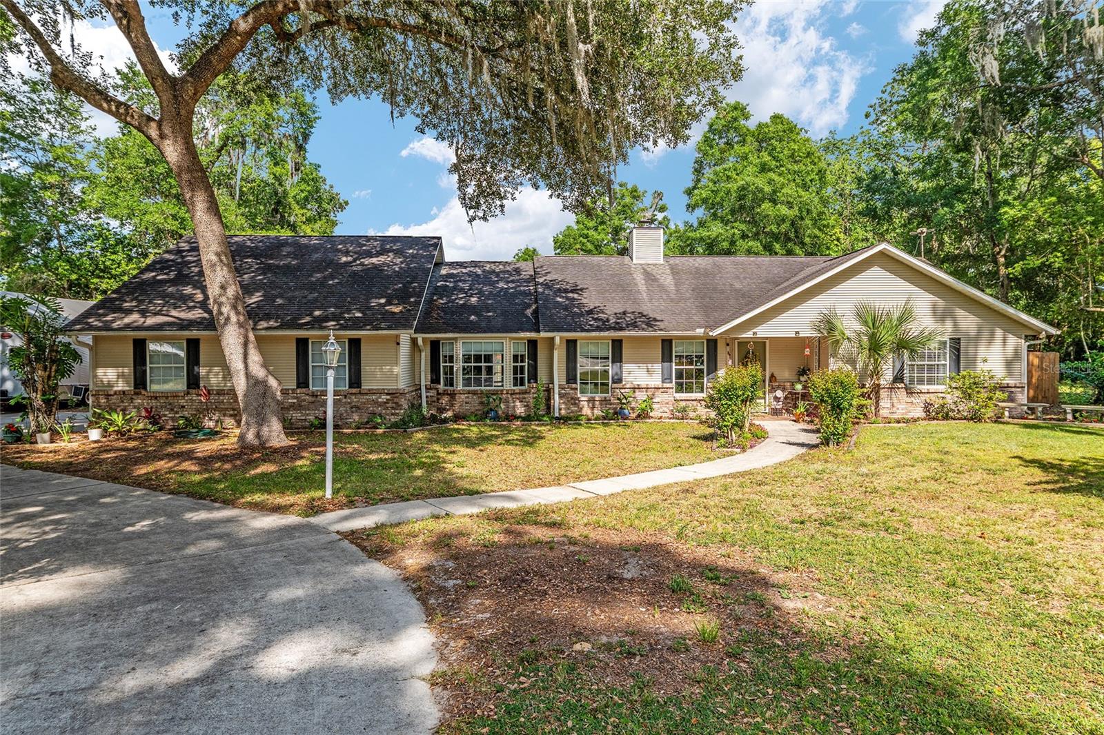 Welcome to your own slice of country paradise in Ocala! This charming 1-acre mini farm offers the perfect blend of peaceful rural living with convenient access to town. Fully fenced and ready for animals, the property is ideal for horses, goats, chickens, or anyone dreaming of a small homestead lifestyle. The land is high and dry with plenty of open space for grazing, gardening, or expanding your vision. Mature trees provide shade and privacy, while the layout offers room for barns, coops, or additional structures. Whether you're an equestrian enthusiast or simply looking for room to roam, this property delivers flexibility and freedom. The home features a warm and inviting layout with abundant natural light and comfortable living spaces. New features as of 2025 include AC, electrical, fencing, interior doors, and primary shower. Pool pump and pool screen replaced is 2024, new garage door and opener in 2023. Enjoy quiet mornings on the pool deck with coffee and evenings watching the sunset over your land. With agricultural-friendly zoning, you have the freedom to truly make this property your own. Located in desirable SE Ocala, you’re just a short drive to shopping, dining, medical facilities, and the renowned horse farms that make this area famous. This is a rare opportunity to own a manageable mini farm in one of Florida’s most sought-after equestrian communities. There is also a back entrance to the property off a paved road for easy access. Bring your animals, your toys, and your dreams—this property is ready to welcome you home.