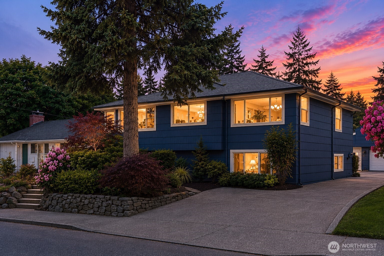 Located in Seattle’s iconic & highly sought-after Queen Anne neighborhood near SPU, this beautifully maintained mid-century home blends timeless character with extensive modern upgrades. Brand New Roof 5/27/2026 & has 50 year warranty! Showcasing exceptional pride of ownership throughout, the home features all-new bathrooms, a remodeled kitchen, all-new “Milgard” windows, new flooring upstairs & down, fresh interior paint in every room, painted woodwork, updated exterior paint, & removal of popcorn ceilings. The oversized living room w/fireplace opens to a sunny south-facing deck w/gas BBQ line stubbed in. The lower level is well updated w/can lighting & a full 2nd kitchen replacing the original bar area, offering incredible flexibility for guests or multi-generational living. The lower primary bathroom features heated radiant marble floors, a new shower, sink, & toilet. Additional improvements include a new furnace with A/C, added heat & A/C in the garage + workshop below, updated electrical & exterior RV power. Outside, the backyard has been transformed into a private retreat with Japanese maple, hydrangeas, dogwood & cherry trees & laurel for added privacy. Hoop virtual staged. Complete with 3 bedrooms, 2.5 baths, a 2-car garage, workshop, and 5-6 off-street parking in addition to the two car garage spaces, this exceptional home is also located within highly rated school boundaries—an outstanding opportunity in one of Seattle’s premier neighborhoods. Home/Sewer inspected.