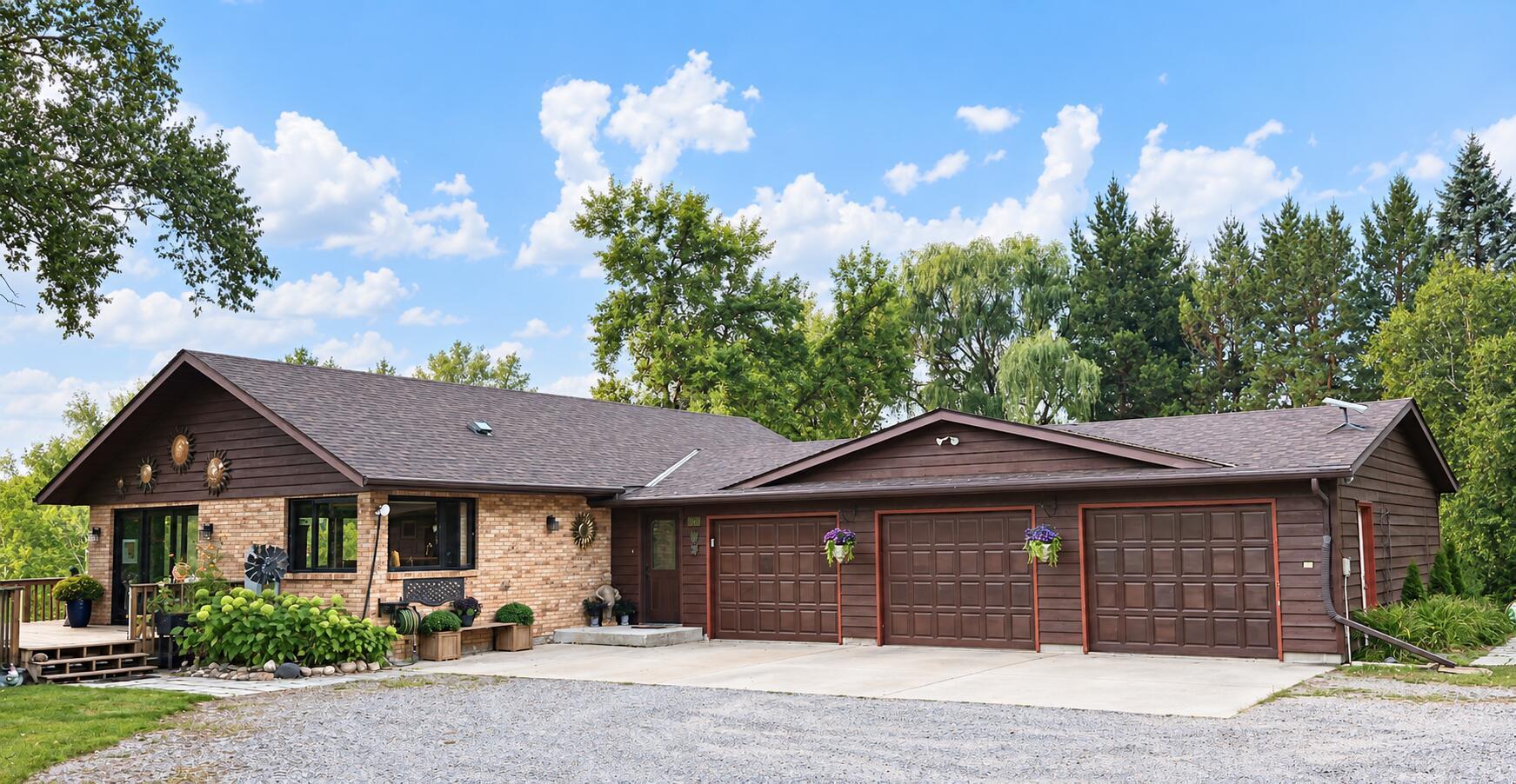 Looking for space, privacy, and room to breathe? Your private 20-acre oasis awaits in Cold Spring, MN. Pristine acreage meets uncompromised utility—offering the perfect country retreat. Whether you envision a hobby farm, a private hunting ground, a business, or simply room to roam, the crown jewel is the fully finished, heated 40 x 56 workshop. Complete with an indoor bathroom, office, and an expansive 20 x 40 outdoor entertainment patio, this property is built for luxury country living. Welcome to 26003 Heritage Rd in Cold Spring, where 20 private acres, abundant wildlife, 5 apple trees, and exceptional amenities come together to create a truly special country retreat. This spacious 2,749-square-foot walkout rambler features three bedrooms, with a flexible fourth, 2 offices, granite counter tops, 6-panel solid wood doors, and two-and-a-half bathrooms.Outdoor enthusiasts will appreciate this true hunter's paradise, where deer are frequent backyard visitors and turkeys, pheasants, geese, ducks, grouse, and other wildlife are abundant. Enjoy picturesque views from the deck overlooking the pond and a charming paver area with multiple bird feeders - the perfect setting to relax, watch the wildlife, and take in the peaceful surroundings. There's a mile and a half of groomed trails going through the 20 acres of woods and grasslands, including a bridge over a small creek. Also included is a large greenhouse and garden, two storage sheds, and a shed with an enclosure ready for chickens.The home includes numerous updates, including new windows, patio and exterior doors, gutters, central A/C, washer and gas dryer, dishwasher, window coverings, new flooring throughout, bathroom updates, and more. A whole-house generator provides additional comfort and peace of mind.The massive 40x56 outbuilding has endless possibilities;  a home business, workshop, hunting headquarters, hobby space, recreational equipment (13’ ceiling height with a 12 x 14 overhead door), storage, or entertaining. It is equipped with full electric (including 220v), lighting, ceiling fans, heat with its own dedicated propane tank, hot water, an office and a half-bath, and has its own septic drain field. A large 20' x 40' concrete patio with a 12’x14’ gazebo just outside creates an ideal space for gatherings, grilling, and outdoor entertaining.Whether you're searching for privacy, room to roam, exceptional hunting and recreation, or simply a peaceful place to call home, this property delivers. With 20 acres, incredible wildlife, beautiful pond views, extensive updates, and a remarkably well-equipped outbuilding, this is a rare opportunity to enjoy country living at its finest in the Rocorri school district.PROPERTY HIGHLIGHTS• 20 private acres • 2,749 sq. ft. home• 3 bedrooms with option for a 4th • 2.5 bathrooms• Abundant deer, turkey, pheasant, geese, ducks and grouse • Pond views and wildlife-watching area• Numerous interior and exterior updates • Full-house generator• Heated outbuilding with electric, hot water, half bath and separate septic drain field • 20' x 40' concrete patio off the outbuilding