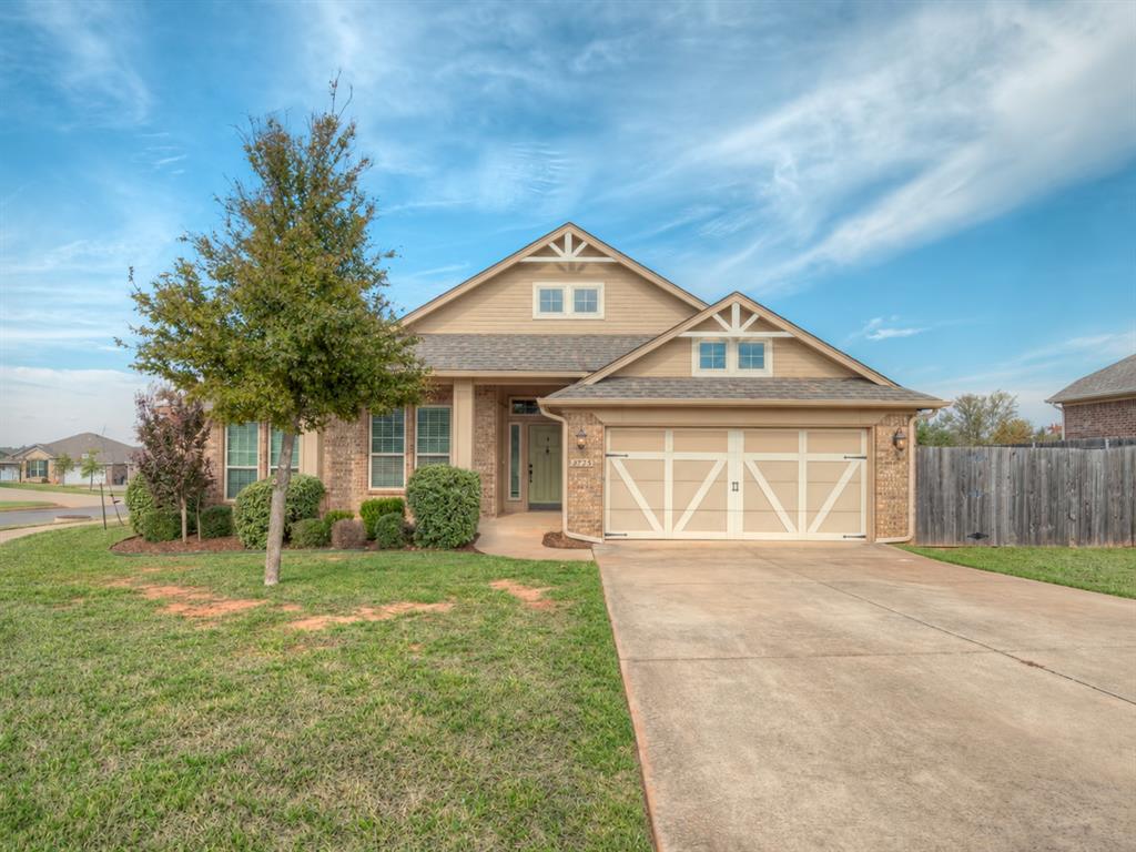 Beautifully refreshed and thoughtfully designed, this move-in-ready home pairs timeless character with inviting comfort in desirable Red Canyon Ranch. Set on a generous corner lot, its handsome brick exterior, distinctive architectural details, and charming covered front porch create exceptional curb appeal. Fresh interior paint, brand-new carpet, updated wood laminate flooring, and new fencing enhance its polished presentation. A welcoming entry introduces an open layout where rich wood-look flooring leads into a light-filled living room. Soaring ceilings lend an airy sense of space, while a grand brick fireplace anchors the room with warmth and texture. A distinctive brick-accented art niche adds architectural charm and a beautiful setting for a favorite piece. Overlooking the living area, the kitchen blends elegant finishes with everyday functionality. Striking quartz countertops complement an abundance of rich stained cabinetry, while a center island, stainless steel appliances, and a spacious pantry make meal preparation and entertaining a pleasure. The adjoining dining area offers an inviting place to gather. Privately positioned apart from the secondary bedrooms, the spacious primary suite provides a peaceful retreat. Its en suite bath features dual vanities, a deep soaking tub, a separate walk-in shower, and a generous walk-in closet. Two spacious secondary bedrooms offer flexibility for family, guests, or a home office, complemented by a guest bath with double vanities. The covered back patio extends the living space outdoors, overlooking a sizable backyard and side yard with room to relax, entertain, or create your own garden retreat. Enjoy Red Canyon Ranch’s walking trails, splash pad, playgrounds, soccer field, and stocked pond, with the OU campus and upcoming entertainment district just a short drive away.