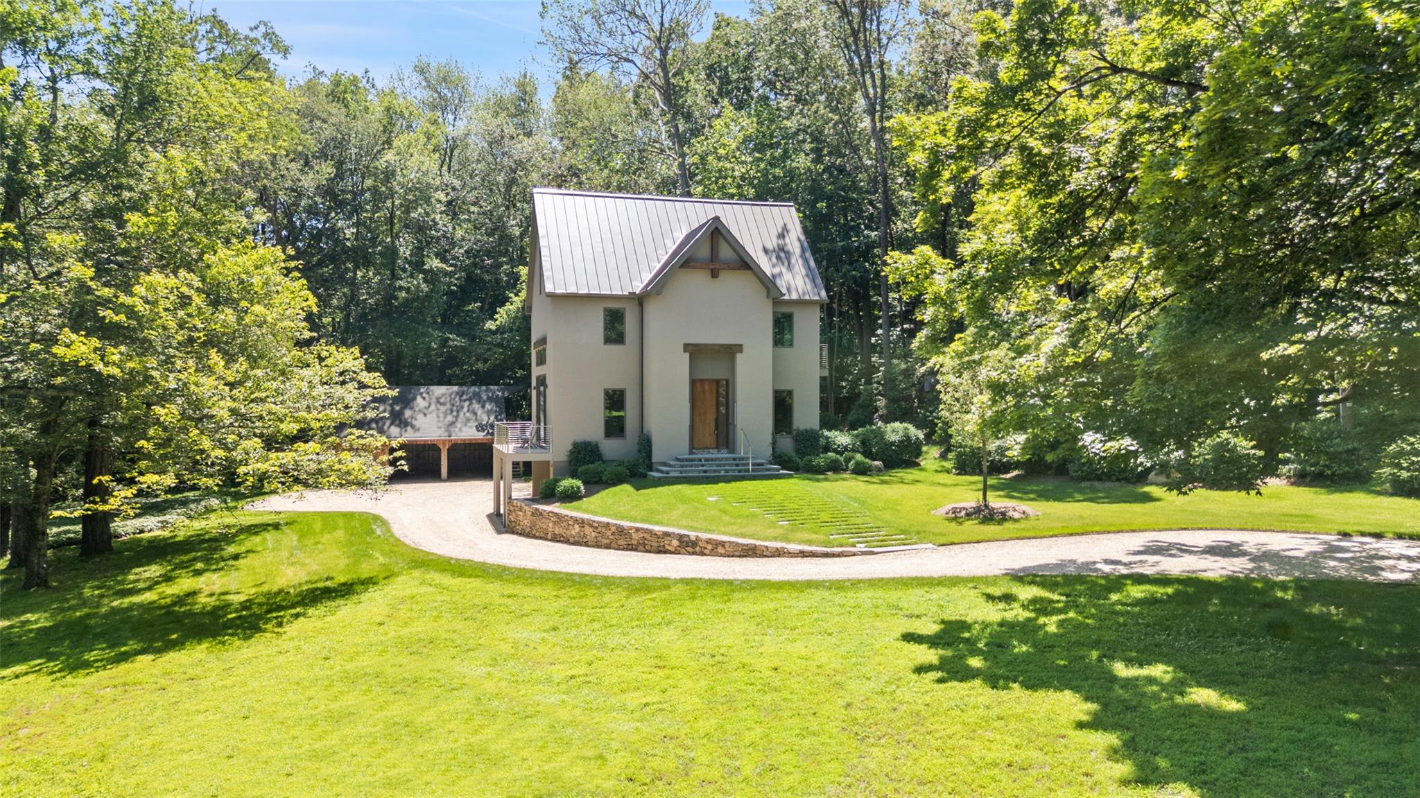 SOPHISTICATED EUROPEAN WARMTH - Modern Farmhouse with stunning interior spaces design and built by high-end local design firm, Deborah Schmidt Design Studio. Sun-filled rooms with high ceilings, crisp lines, custom lighting and rift and quartered, white oak floors. Easy, open floorplan designed for today’s lifestyle. Dramatic Great Room with soaring ceiling and glass doors to Mahogany deck. Sleek Kitchen with high-end appliances. Family Room with fireplace. Loft Office for working remotely. Three Bedrooms with choice of first or second floor Primary Suites. Luxurious Baths with Lefroy Brooks Fittings. All new mechanicals including automatic generator and wiring for SONOS. Over two, peaceful acres overlooking a pristine, spring-fed pond perfect for winter skating and ice hockey. Garage Barn with ample storage and potential Studio, Office or Gym space. Conveniently located with easy access to the historic hamlet, elementary school and town park. Just completed and never before offered!