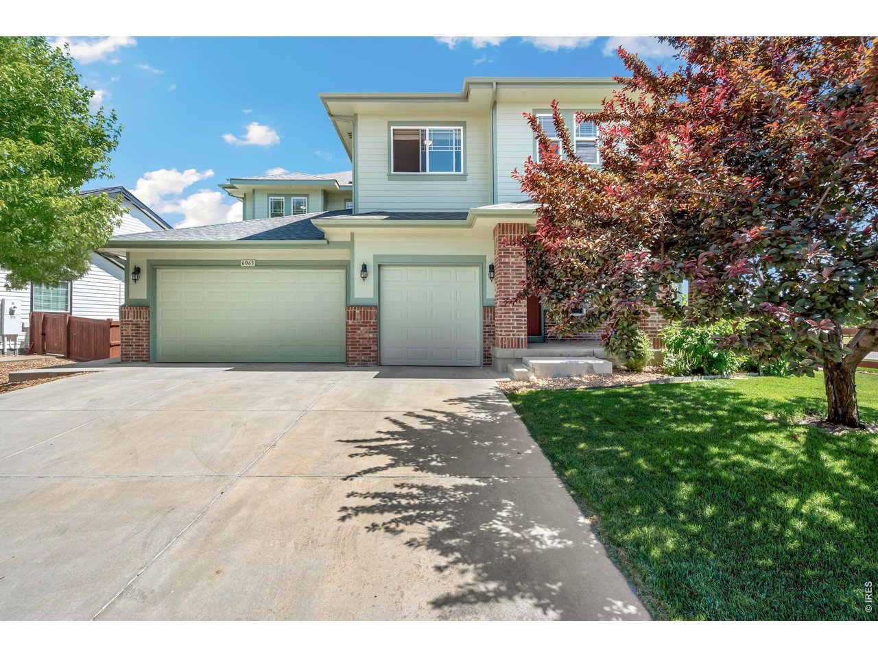 Located in southwest Timnath and backing to a greenbelt buffer, this two-story home offers privacy, views, and a prime corner lot location just across from a neighborhood park! An inviting entry leads into a light-filled living area with vaulted ceilings, hardwood flooring throughout, and a gas fireplace centerpiece. The standout kitchen is built to impress, featuring stainless steel appliances including dual ovens and a gas range with pot filler and hood, quartz countertops, dual eat-in islands, a large pantry, and a media center. A separate dining area offers the perfect setting for gatherings and special occasions. Flexible spaces on the main level include a dedicated office near the entrance, and a main-floor bedroom with its own ensuite bathroom that adds convenience for guests or multi-use living. Upstairs, a cozy loft overlooks the main level, creating a perfect lounge space or reading nook while connecting four additional bedrooms. The primary suite features tray ceilings, a luxurious 5-piece ensuite bath, and a walk-in closet that conveniently connects to the laundry area. Two bedrooms share a Jack-and-Jill bathroom, while the fourth sits adjacent to another full bath. Downstairs, an unfinished basement provides a blank canvas for future expansion, storage, or customization. The landscaped backyard includes a covered patio and raised garden beds for hobby farming, offering a great mix of relaxation and function. A heated 3-car garage adds convenience with ample space for cars, tools, and recreational gear. Solar panels are also installed, offering long-term energy benefits. Beautiful neighborhood surrounded by trails and open spaces, with quick access to South Timnath Center and Pool, Timnath Park, I-25, Old Town Timnath, and Harmony Road for easy commuting and everyday convenience.