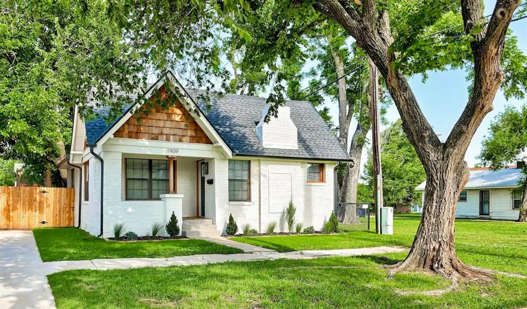 Tucked inside the Gatewood Historic District, this home strikes that perfect balance between early 20th-century charm and the conveniences we crave today. Recently remodeled in 2022, every major update has already been taken care of—new roof, gutters, fencing, HVAC, vinyl windows, flooring, carpet in the bedrooms, fresh paint, and all new fixtures. The result is a home that feels brand new while still honoring its classic character. Step inside and you’re greeted by an open living, dining, and kitchen space where natural light bounces across fresh surfaces. The living room’s fireplace adds just the right note of coziness, and the kitchen—with its subway tile backsplash, soft-close shaker cabinets, granite countertops, stainless steel appliances (including a farmhouse sink), and garbage disposal—invites both everyday cooking and dinner parties. Lighting throughout has been upgraded to LED, giving the home a bright and efficient glow. The bedrooms and hallway offer clever shelving and storage, while a separate utility room with cabinets keeps life’s practical necessities neatly out of sight. Outside, the setting is just as thoughtful: a small fenced backyard shaded by a beautiful tree with synthetic turf for low-maintenance greenery, complemented by a paver stone patio. Off to the side, there’s a real grass yard—perfect for a pet who likes space to wander. The curb appeal is undeniable with its white brick exterior, cottage-style wood siding accents, covered stone-tiled porch, and double garden beds ready for seasonal color. And then there’s the location: just blocks from the Plaza District, you’ll be moments from Midtown and Downtown while still enjoying the quieter, neighborly feel of Gatewood. With a paved driveway for parking, smart use of space, and that sought-after blend of history and modern comfort, this home is as practical as it is charming.