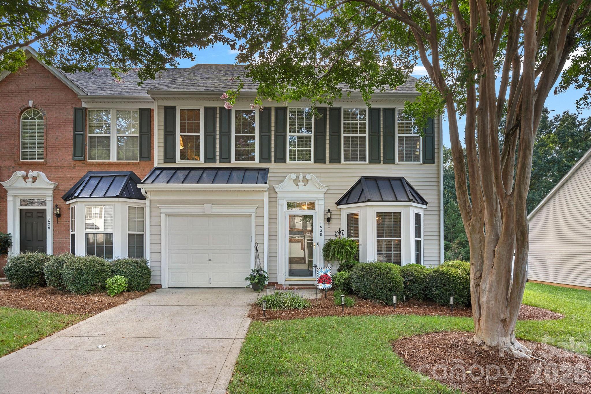 Welcome home to this beautifully updated, move-in-ready townhome in highly desirable Robinwood Village! Offering 3 bedrooms, 2.5 bathrooms, an attached garage, a main-level primary suite, and a private fenced backyard, this meticulously maintained home combines modern updates, comfortable living, and a low-maintenance lifestyle.Step inside and immediately notice the bright, inviting interior featuring LVP flooring throughout the main level, fresh neutral paint, updated lighting, and a newer HVAC system installed in 2024. At the heart of the home is the thoughtfully updated kitchen, designed to be both stylish and functional. Enjoy beautiful quartz countertops, updated appliances, a breakfast bar, dining area, and a light-filled breakfast nook—perfect for everything from your morning coffee to entertaining family and friends.The impressive two-story living room creates an open and airy atmosphere with soaring ceilings, abundant natural light, and a cozy gas fireplace that serves as the perfect focal point.One of the home's standout features is the main-level primary suite, offering comfort and convenience with a spacious walk-in closet and private bath featuring a garden tub, separate walk-in shower, and oversized vanity. The main level also includes a half bath and conveniently located laundry closet.Upstairs, an open loft overlooking the two-story living room provides flexible space for a home office, reading area, playroom, or additional lounge. Two generously sized secondary bedrooms each feature walk-in closets and share a full bathroom. You'll also appreciate the additional storage room, which is not included in the home's heated square footage.Step outside to your own private, fenced backyard and patio, complete with accent lighting and plenty of space to relax, entertain, or simply unwind at the end of the day.Best of all, enjoy the benefits of low-maintenance living, with landscaping and mowing handled by the HOA—giving you more time to enjoy the things that matter most. Robinwood Village also features sidewalks and private walking trails, perfect for a peaceful morning jog or an evening stroll.Conveniently located near shopping, dining, I-85, Highway 321, Charlotte, and Charlotte Douglas International Airport, this home offers an ideal combination of comfort, convenience, and easy living.Beautifully updated, meticulously maintained, and truly move-in ready—this is one you won't want to miss. Schedule your private showing today and come see why this could be the perfect place to call home!