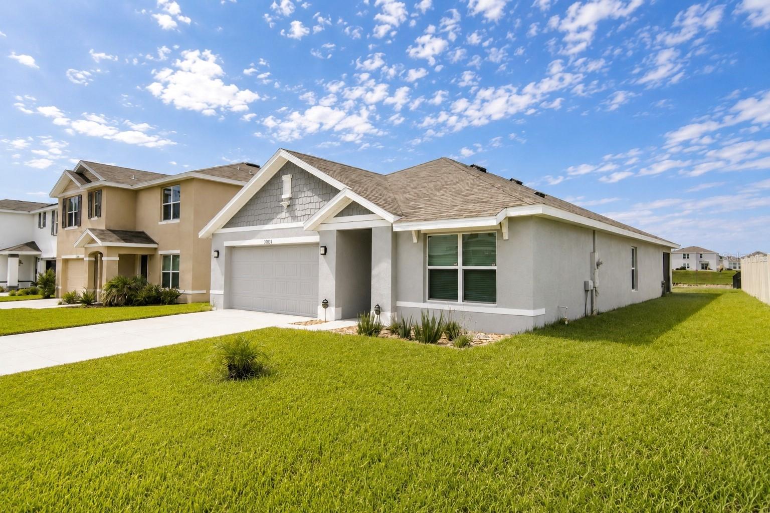 Beautifully Maintained 2023-Built Home in Zephyrhills!Welcome to 3709 3 Sharks Eye Lane, a beautifully maintained 3-bedroom, 2-bathroom home offering 1,690 square feet of comfortable, modern living space in a desirable Zephyrhills community. Built in 2023 and very lightly lived in, this home feels practically brand new and is move-in ready! The open-concept floor plan creates an inviting space for everyday living and entertaining, with a spacious kitchen featuring granite countertops and plenty of room for family and guests. The primary suite offers a private en-suite bathroom, providing a comfortable retreat at the end of the day. Step outside through the living area to the screened-in lanai, where you can enjoy your backyard with peaceful views toward the community retention pond. The backyard provides a nice sense of privacy and is perfect for relaxing or enjoying Florida's beautiful weather. Additional features include an epoxy-coated garage floor, modern finishes throughout, and the peace of mind that comes with a home built in 2023. Located in a great Zephyrhills neighborhood with a low HOA fee and convenient access to shopping, dining, major roadways, and everything the area has to offer. Very lightly lived in, easy to show, and truly move-in ready—schedule your private showing today!