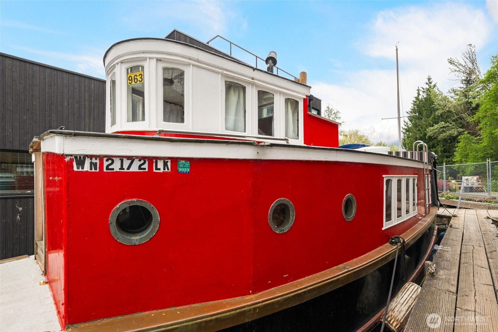 Classic Seattle character meets waterfront adventure aboard the iconic Red Tugboat on Lake Union. Thoughtfully maintained and updated, this one-of-a-kind floating home offers an incredibly rare opportunity to enjoy Seattle’s coveted houseboat lifestyle at an approachable price point. Tucked into prime condo-owned moorage, the location is hard to beat—with direct trail access to Gas Works Park, the Burke-Gilman Trail, and easy connections to Fremont, Wallingford, and the University District.Inside, the efficient layout is warm, functional, and surprisingly comfortable, designed for simple living with everything within reach. The well-managed dock community includes on-site laundry, showers, secure off-street parking, mailroom, garden space, and optional storage. Pet-friendly and rental-friendly (30-day minimum), this charming in-city escape offers flexibility as a full-time home, pied-à-terre, or investment opportunity.