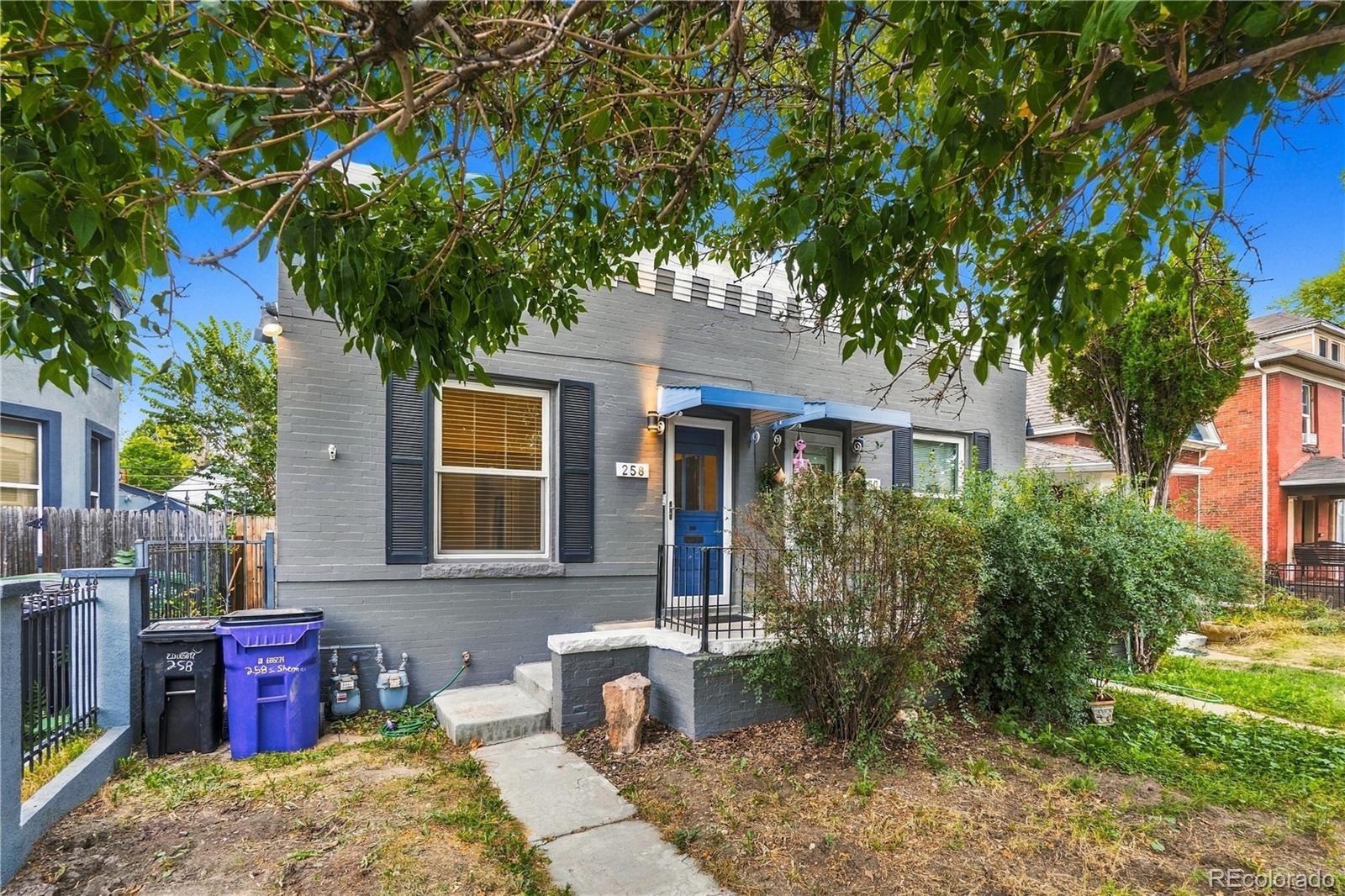 Location, character and classic Denver charm come together at 258 S Sherman Street. This 1909 rowhome offers an opportunity to own in a highly desirable central Denver location just blocks from the restaurants, shops and entertainment along South Broadway and less than a mile from Washington Park. Inside, original hardwood floors and exposed brick bring warmth and character to the home, complemented by an updated kitchen with shaker cabinetry, under-cabinet lighting and stainless steel appliances. The shotgun-style floorplan offers flexible living space, a full bath, in-unit laundry and central air. Step outside to a private fenced backyard with room to relax, entertain or garden. A rare oversized detached brick garage provides valuable off-street parking and additional storage. Easy access to the Cherry Creek Trail, downtown Denver and I-25 adds to the convenience. Whether you're looking for a primary residence, Denver pied-à-terre or an opportunity to put your own touch on a classic city home, this one delivers location, character and possibilities.